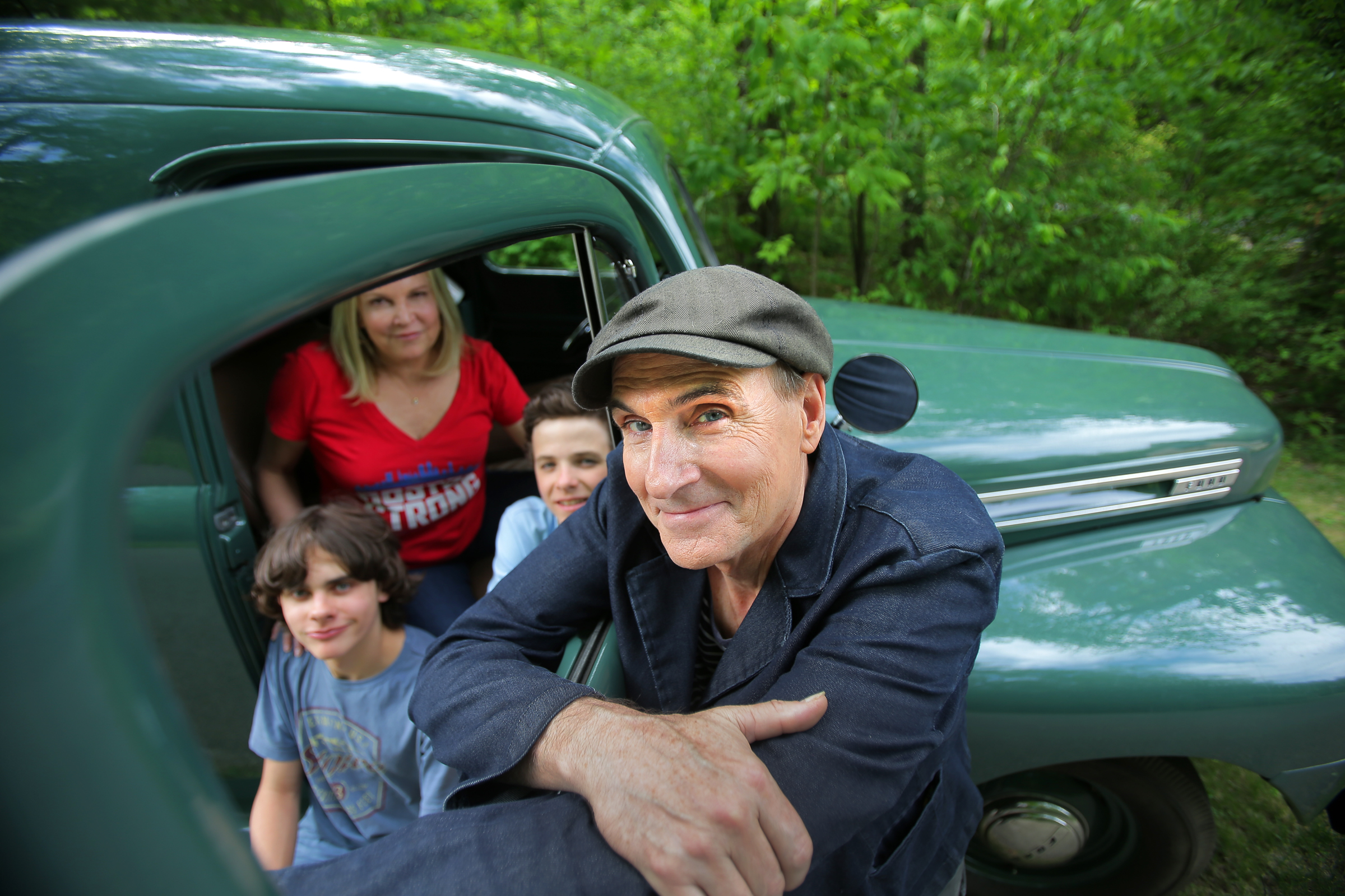 James Taylor, pictured with his wife, Kim, and twin sons Rufus (left) and Henry.