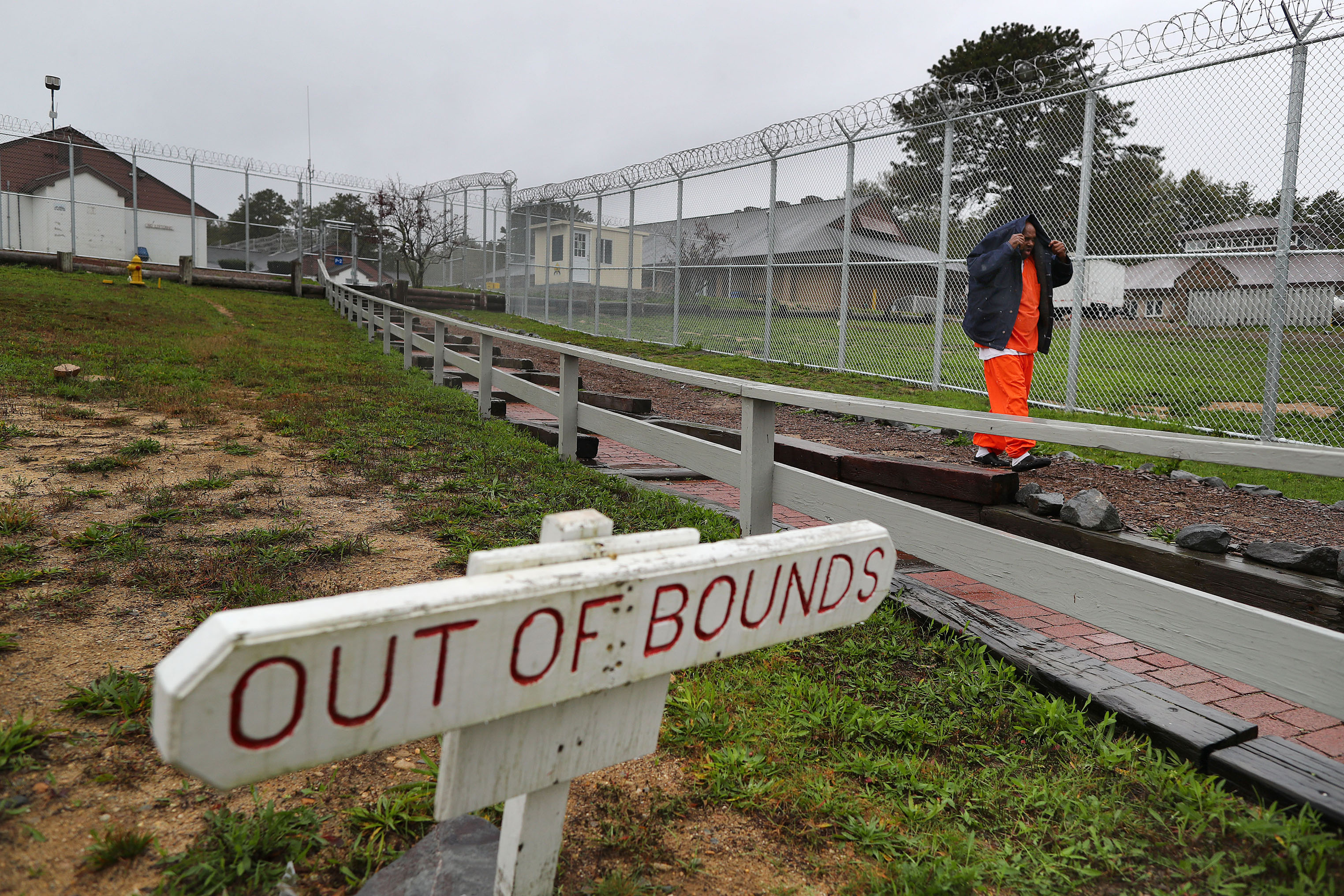 Razor-wire fence was placed around the site after officials said some patients were fleeing into the woods that surround it.