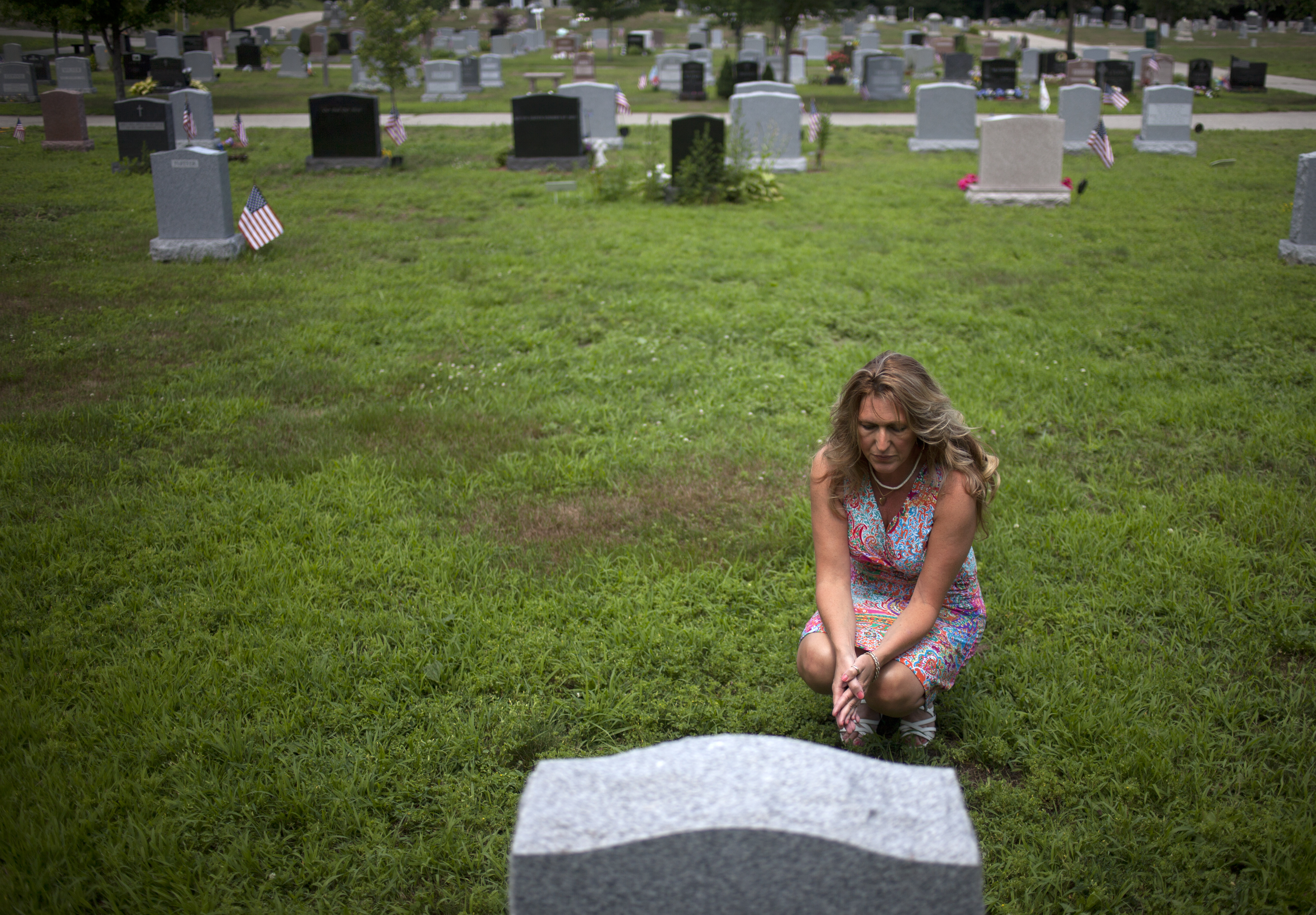 Kathy Gorham, who donated a kidney to her sister, Theresa Robertson, visited Robertson’s grave at Fairmount Cemetery in East Weymouth on Friday.