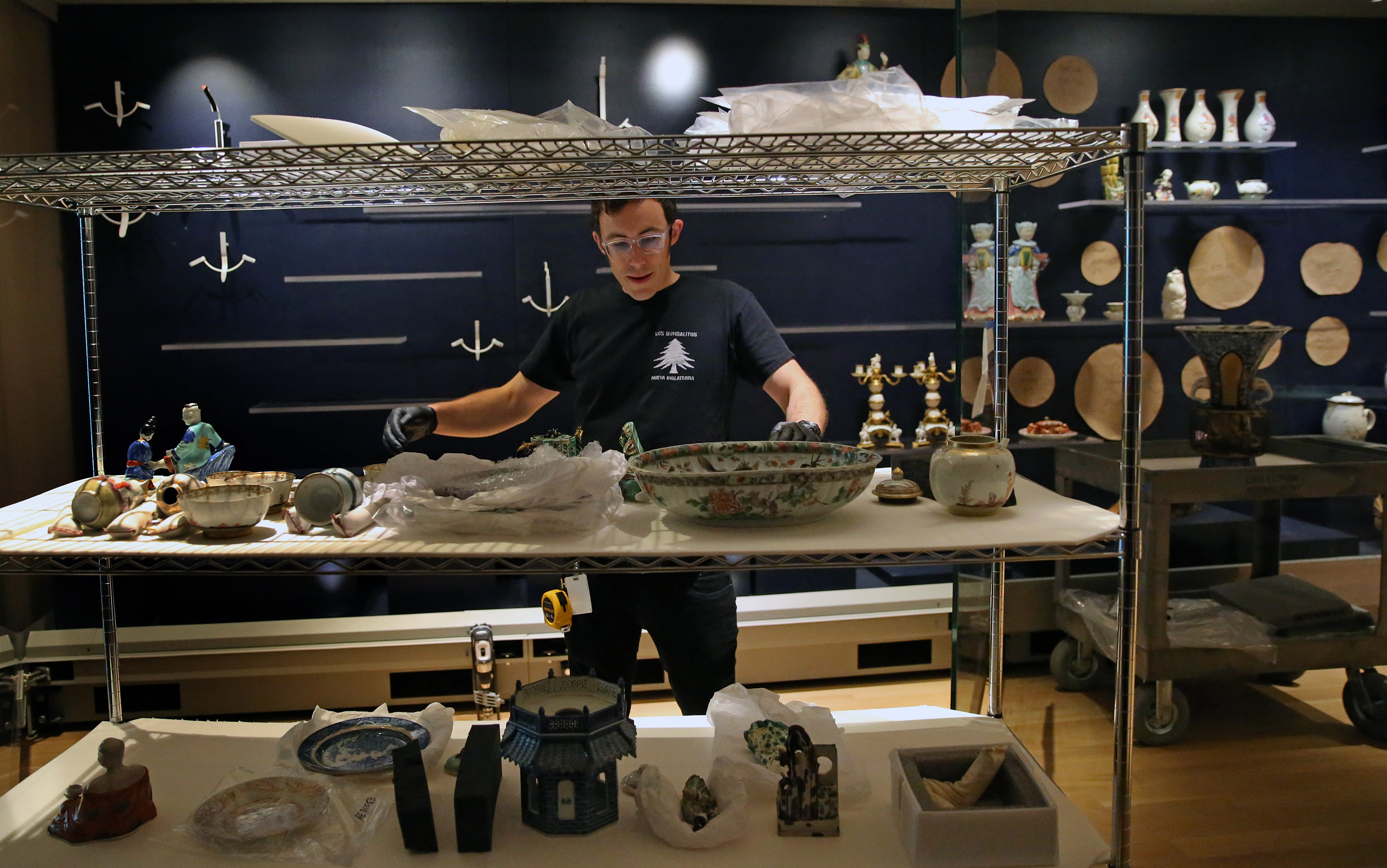A worker arranged pieces that will be on display at the museum.