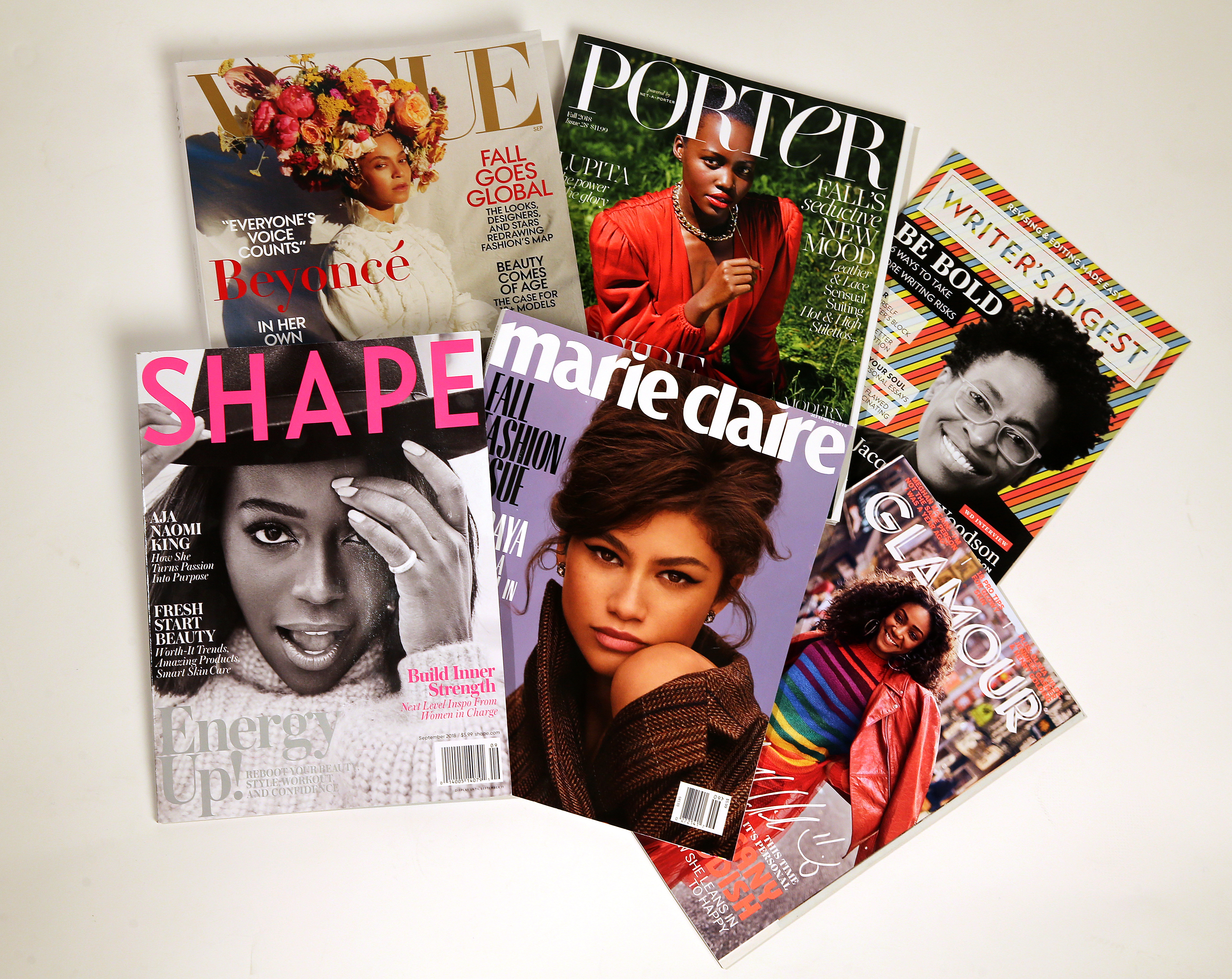 Magazines with photos of black women on their covers.