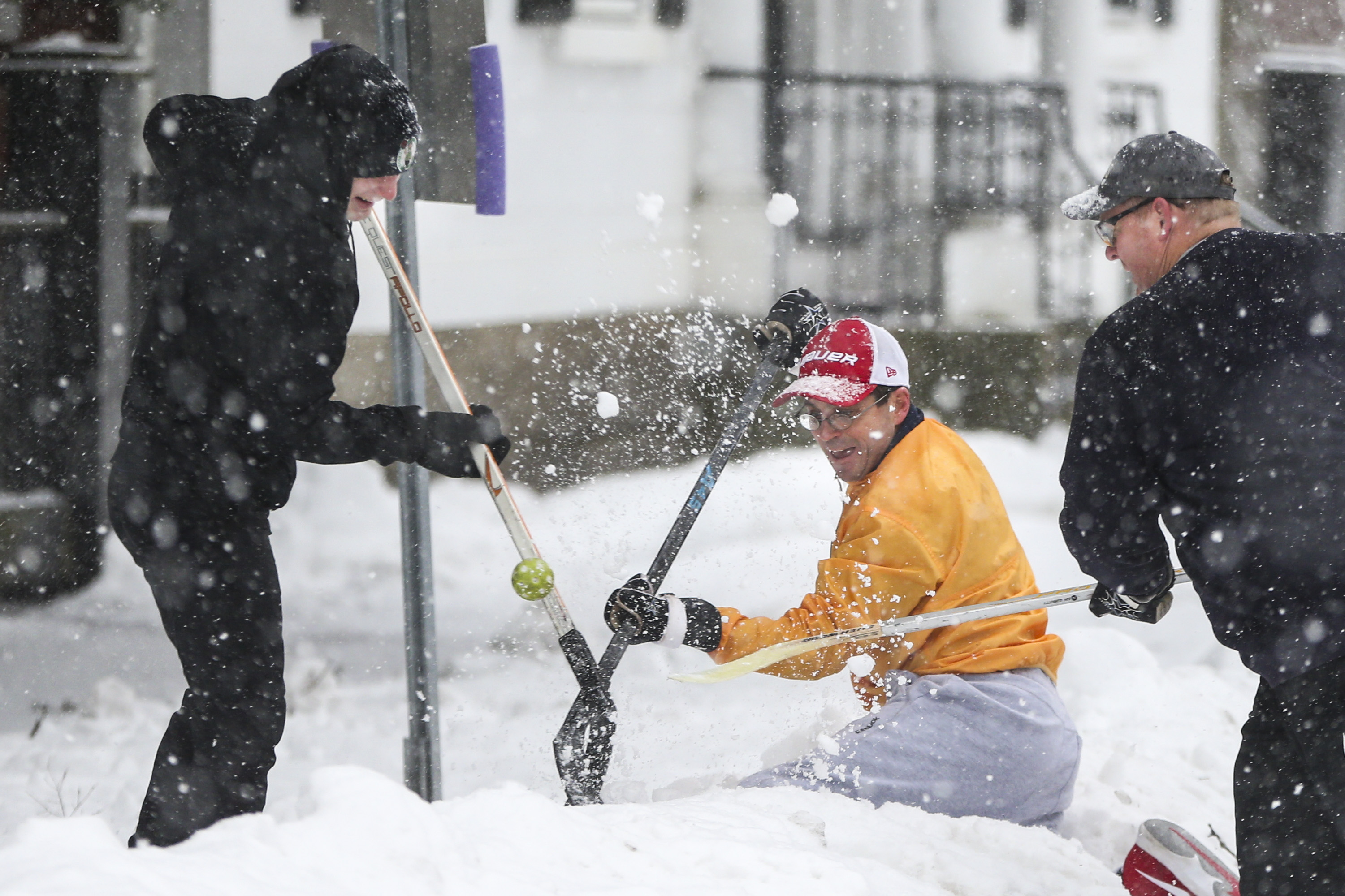 Aiden Gordon, Dave Stelluto, and Jim Whitehead competed for the ball stuck — and against a snow bank.