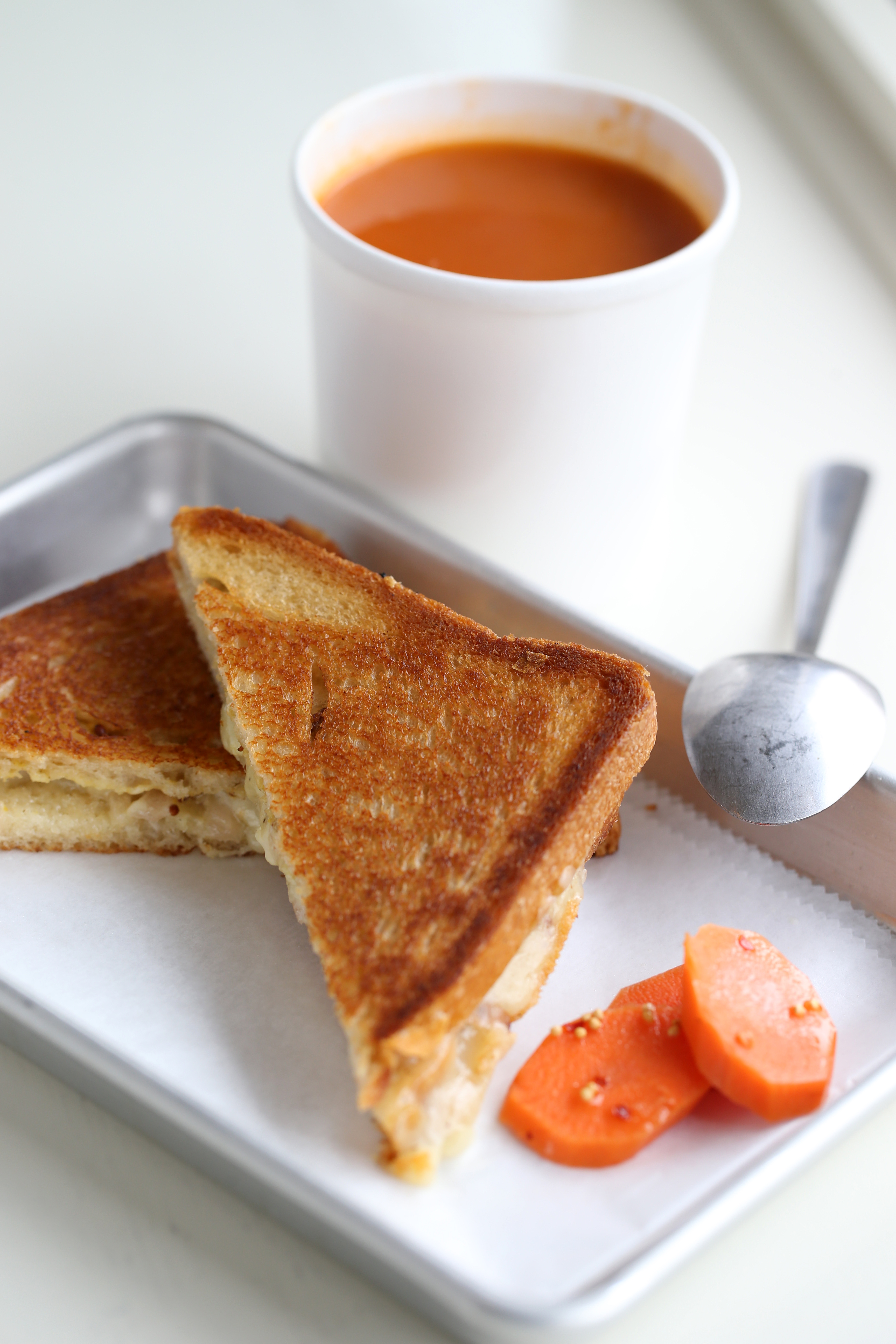 Grilled cheese sandwich with smoky tomato soup.