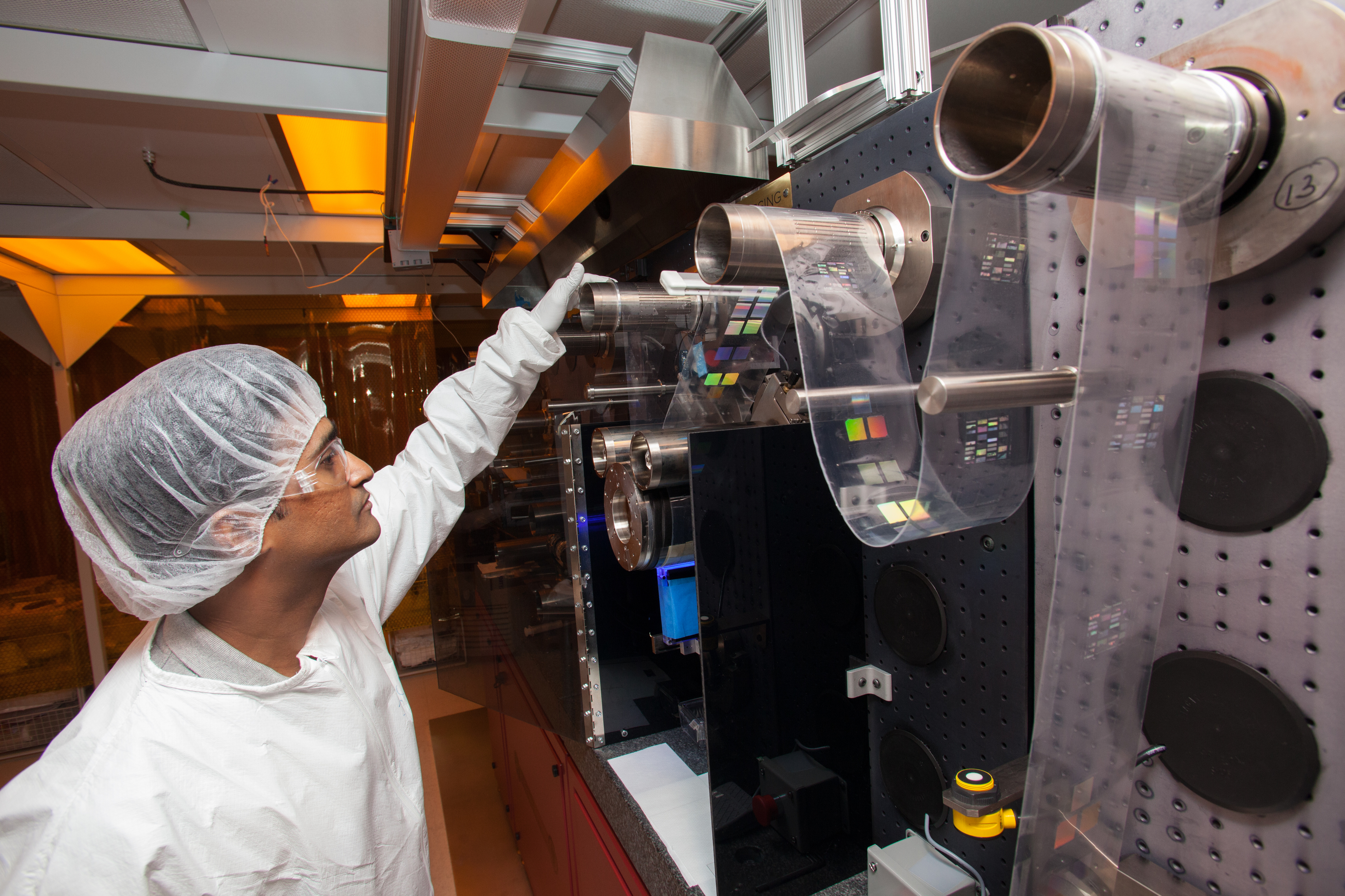 Jacob John, a senior research assistant at UMass Amherst, demonstrated a machine that, using nanotechnology, fabricates sensors that can monitory human vital signs.
