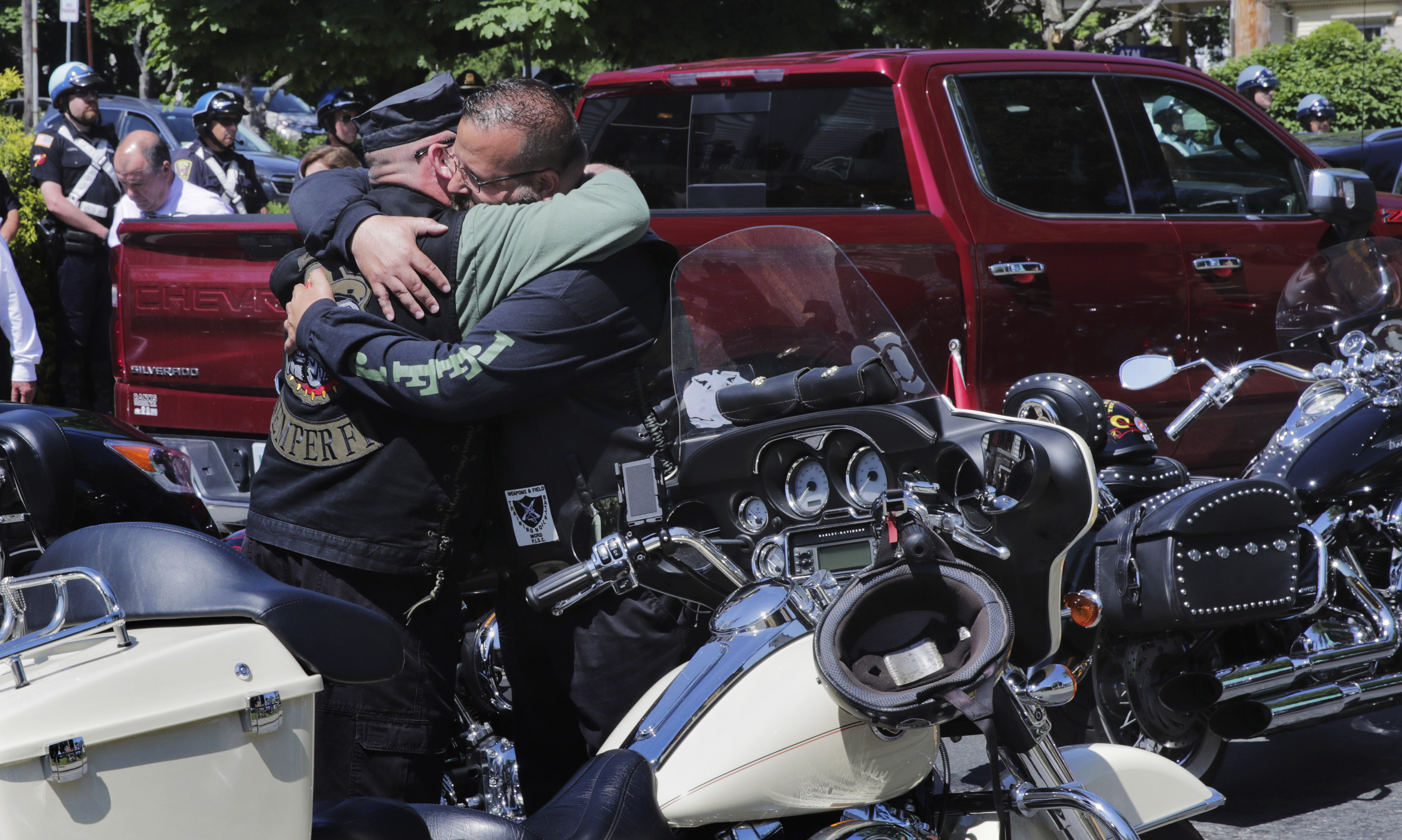 Members of the Jarheads Motorcycle Club embraced.