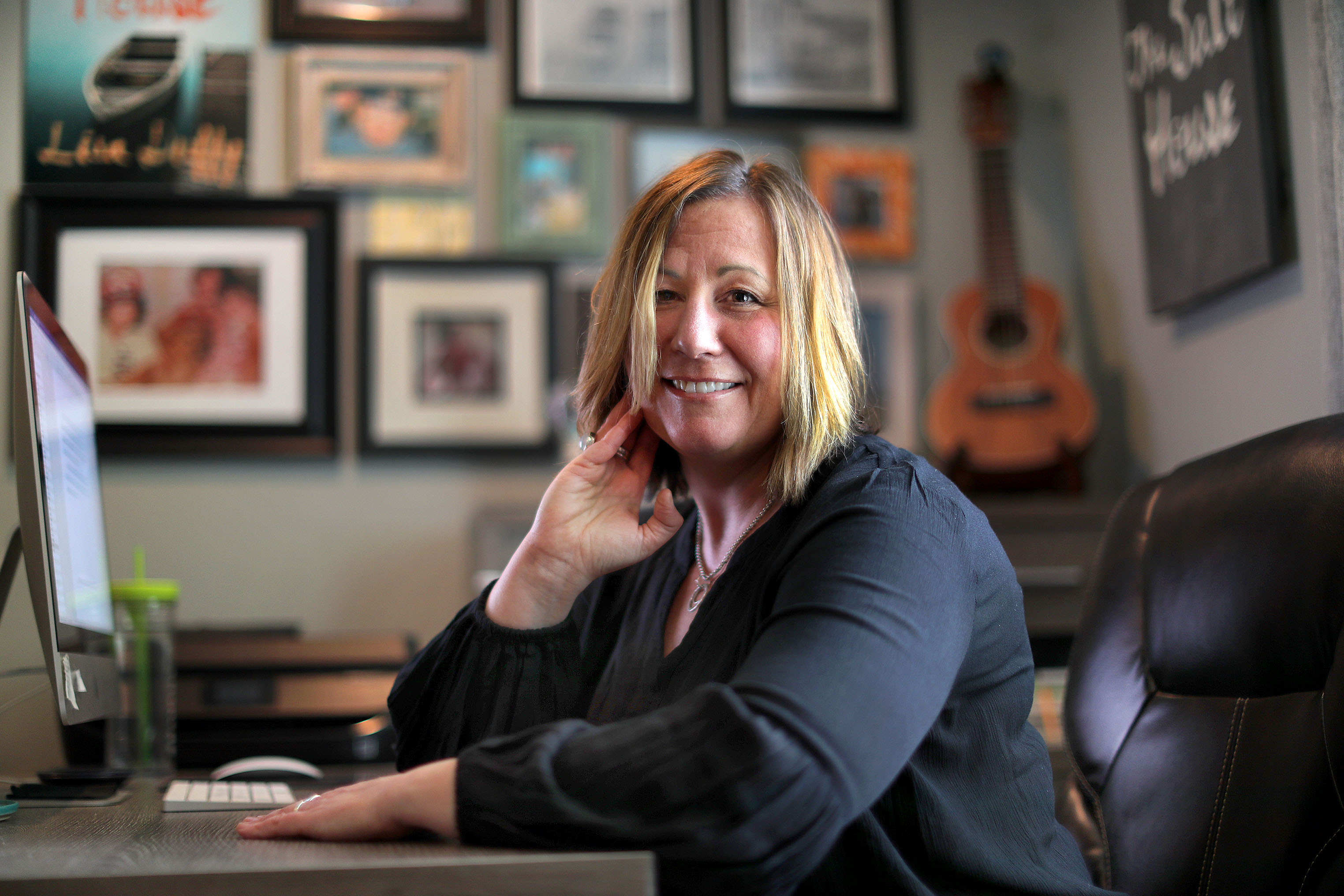Lisa Duffy sits in her home office.