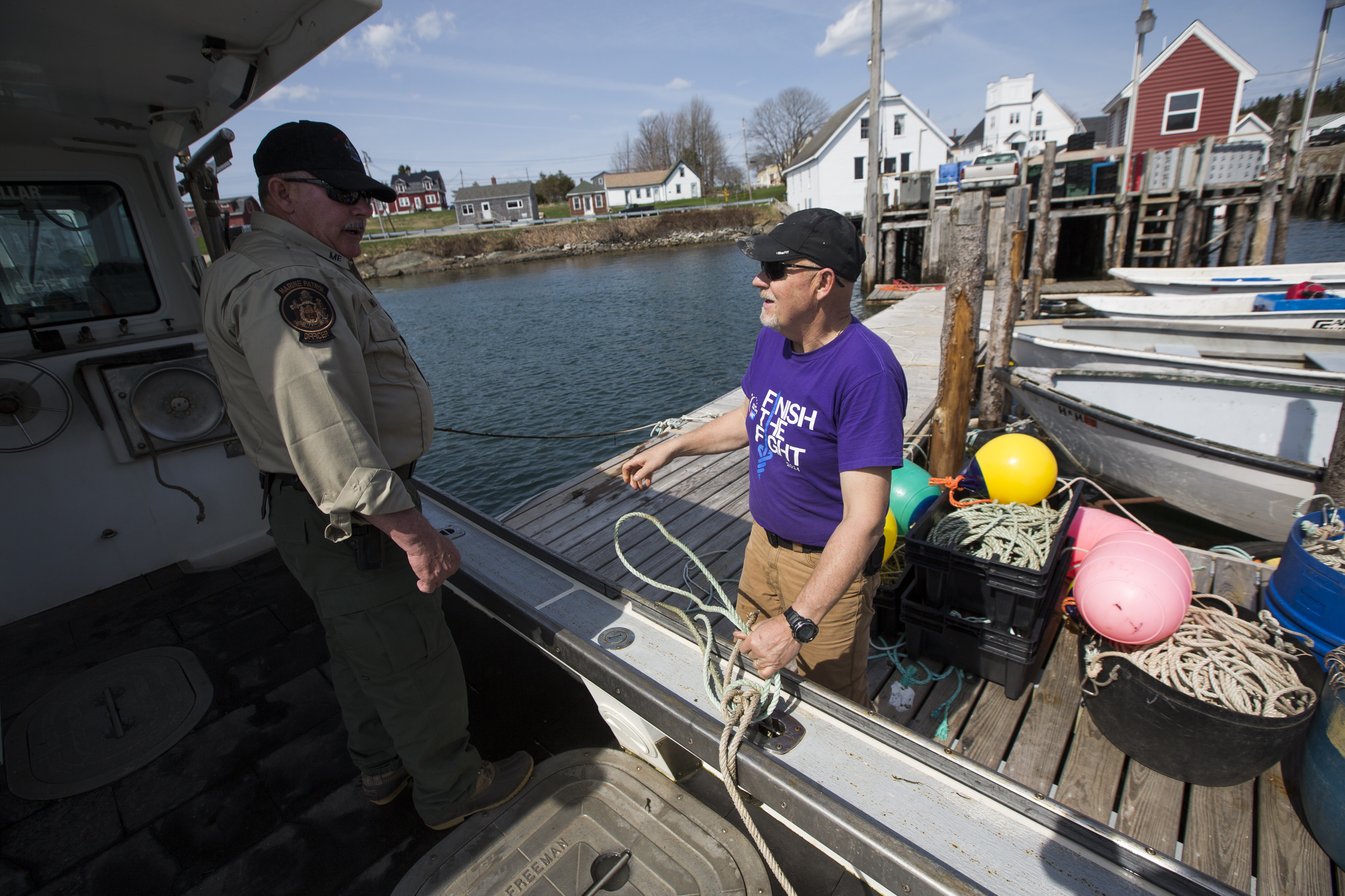 Maine Marine Patrol specialist Mark Murray with lobsterman Brian Cates of Maine.