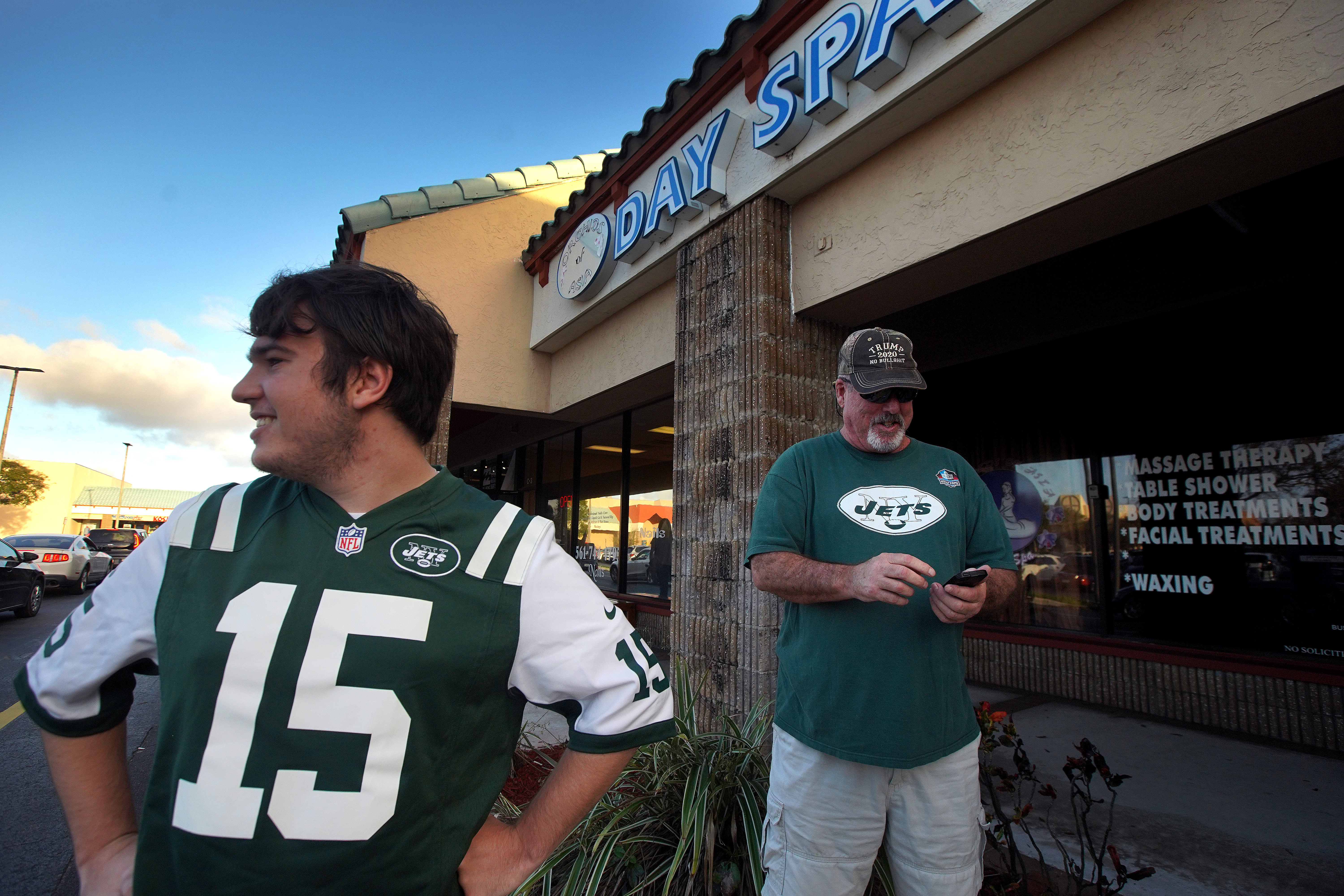 News of the Patriots owner being charged with solicitation of prostitution at Orchids of Asia Day Spa in Jupiter brought New York Jets fans Matthew Gizze and Mike Brown to the scene.