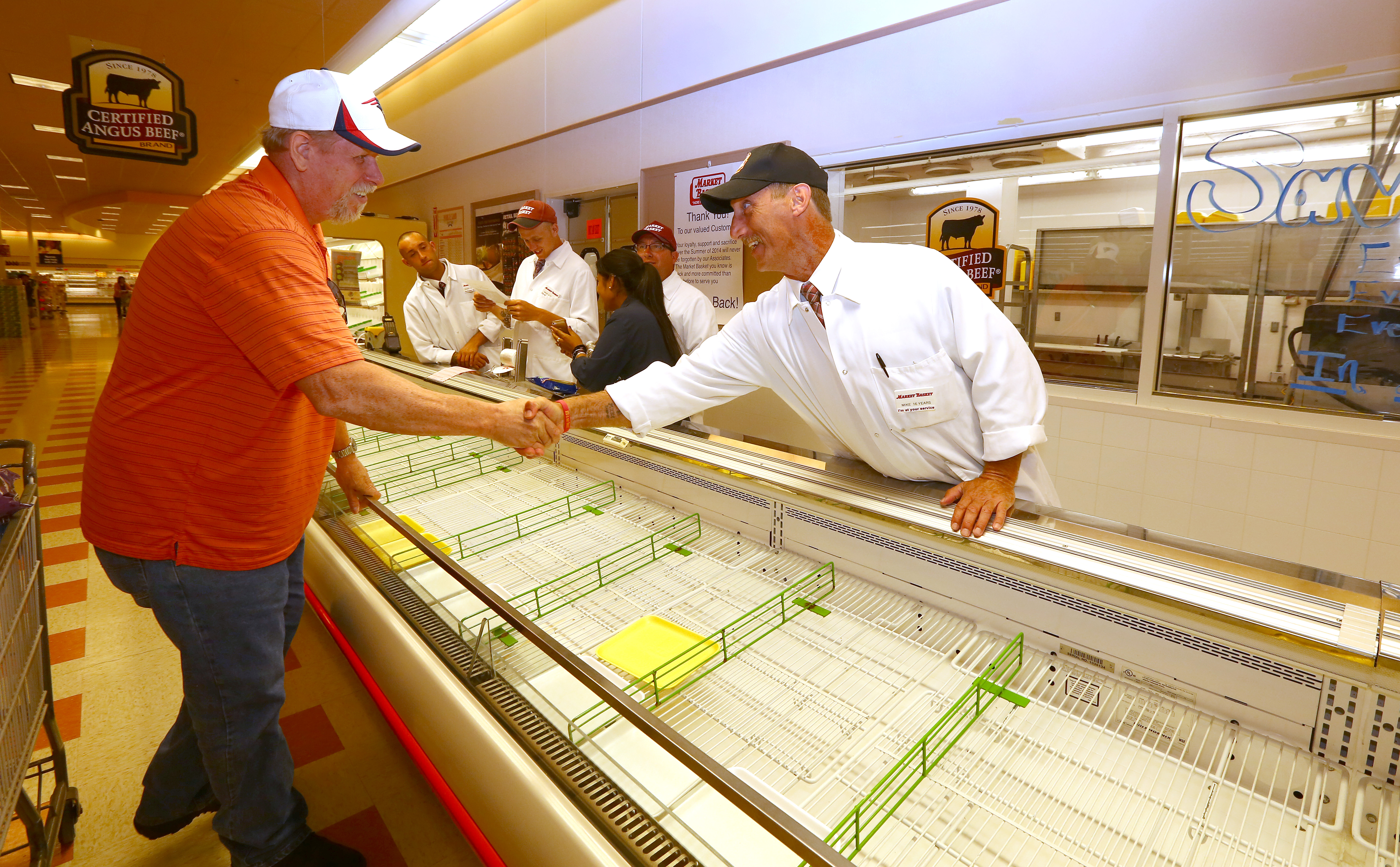 Assistant meat manager Mike Coakley welcomed back customer Lennie Palmer.