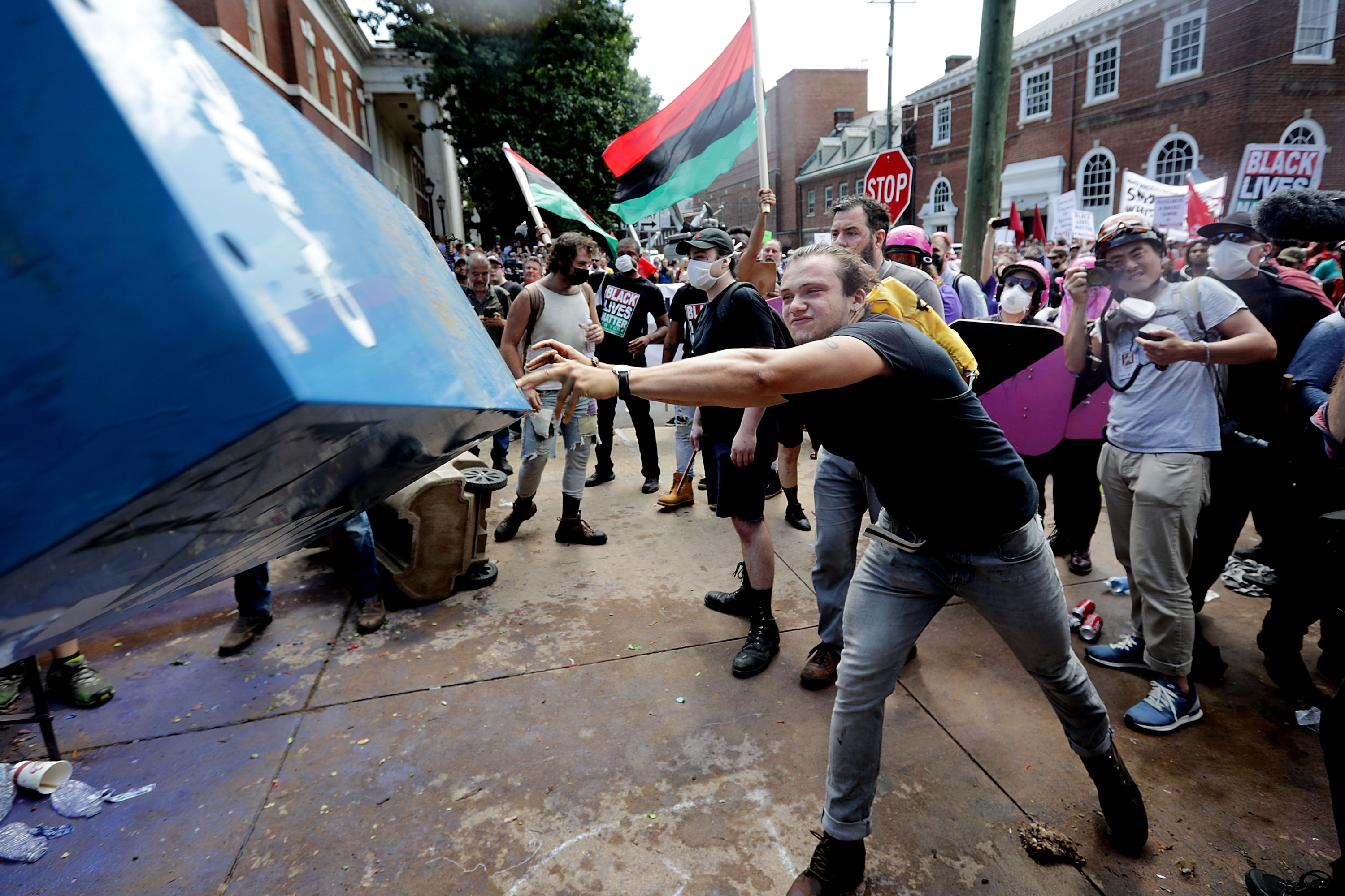 A counterprotester threw a newspaper box toward white nationalists in Charlottesville on Saturday.