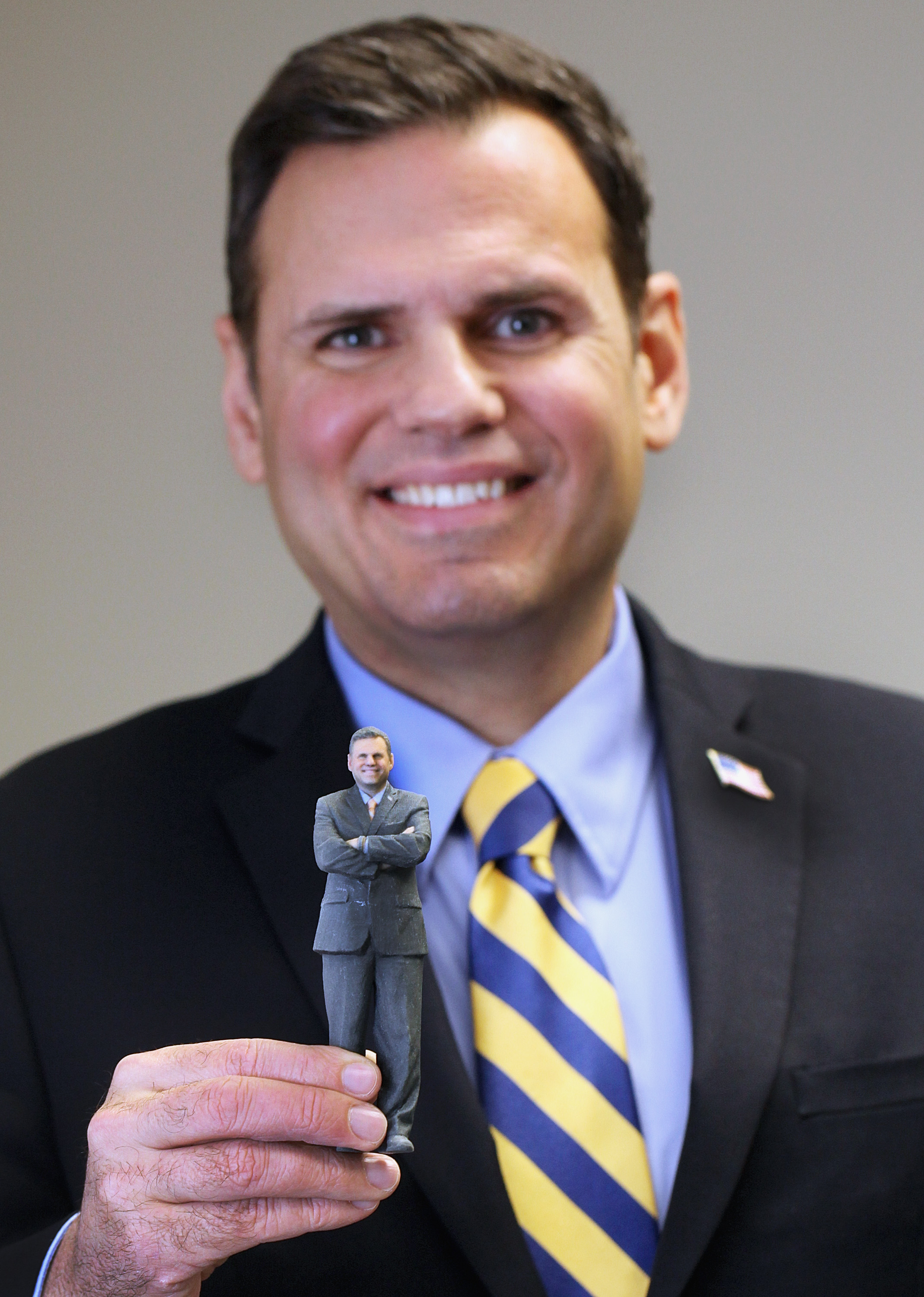 Malden Mayor Gary Christenson and his sandstone figurine.