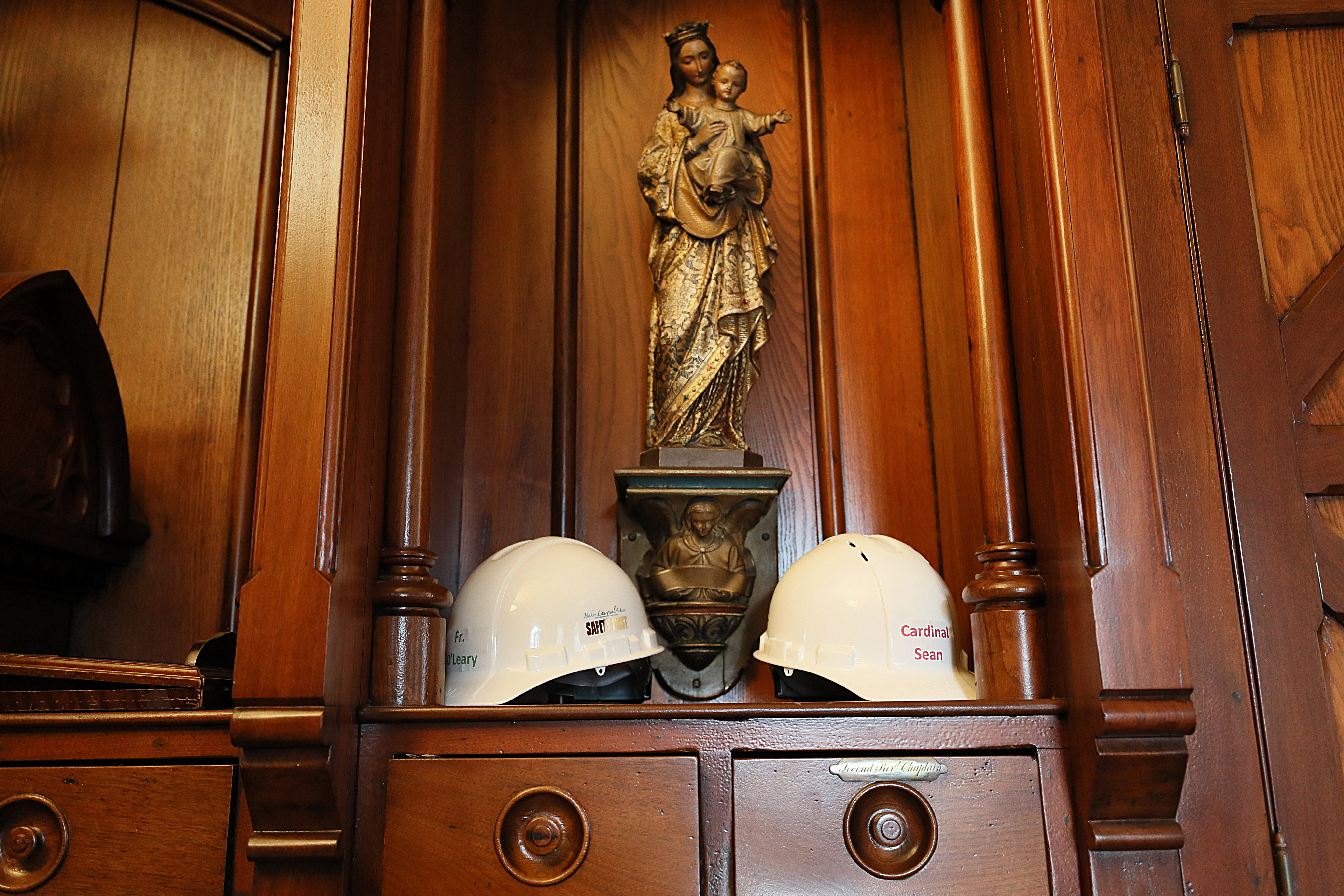 Construction hats for Father Kevin O'Leary and Cardinal Sean O'Malley were visible at the Cathedral.