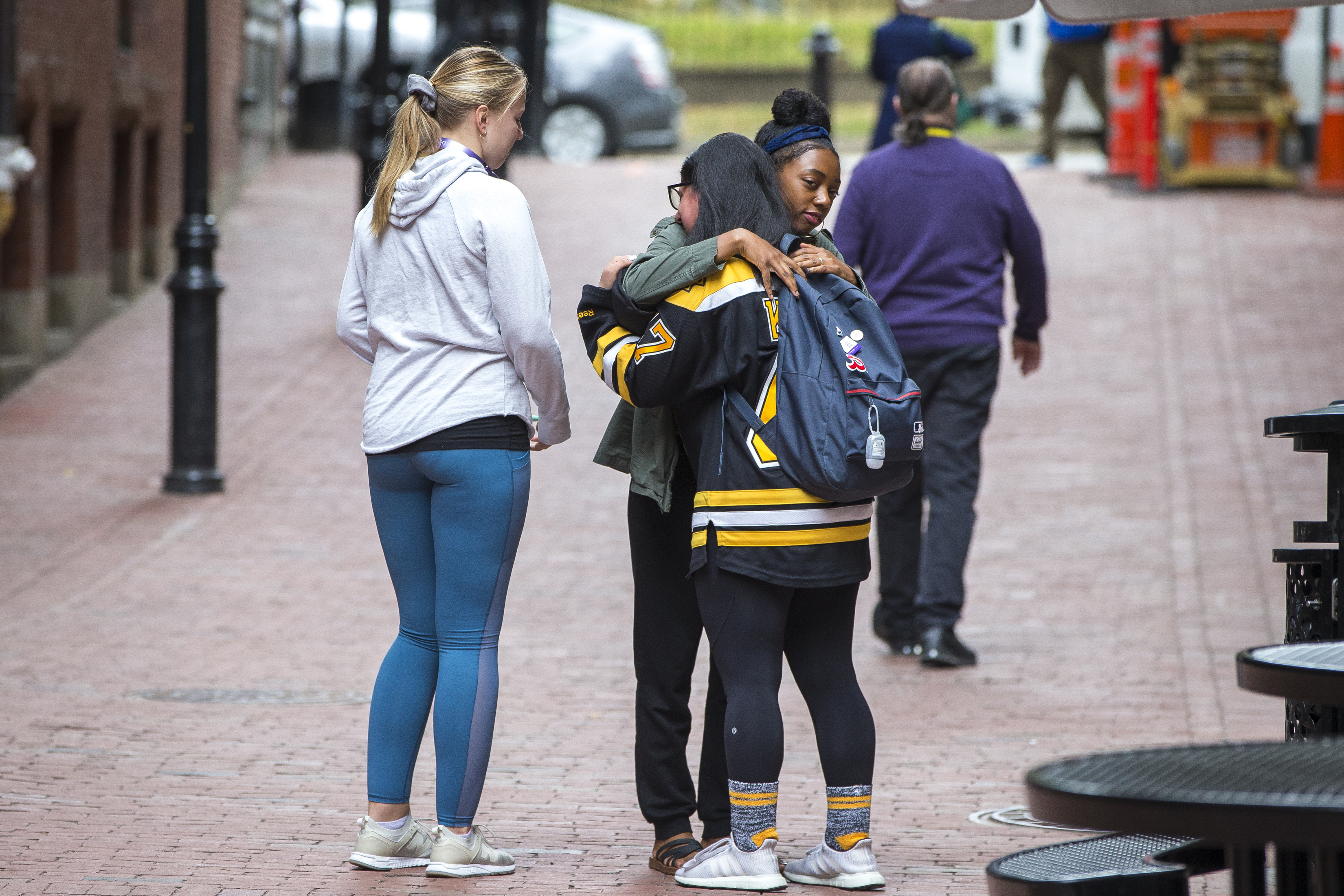 Two women embraced outside the event Thursday.