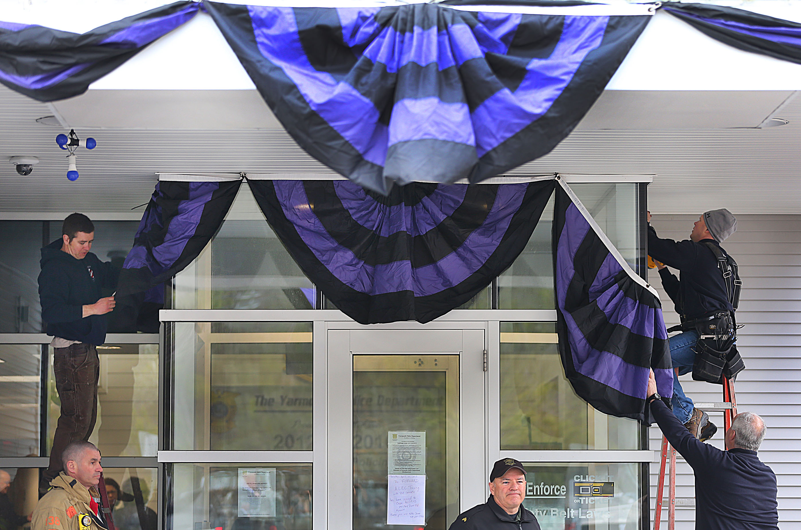 Bunting is put on the front of the Yarmouth Police Station.