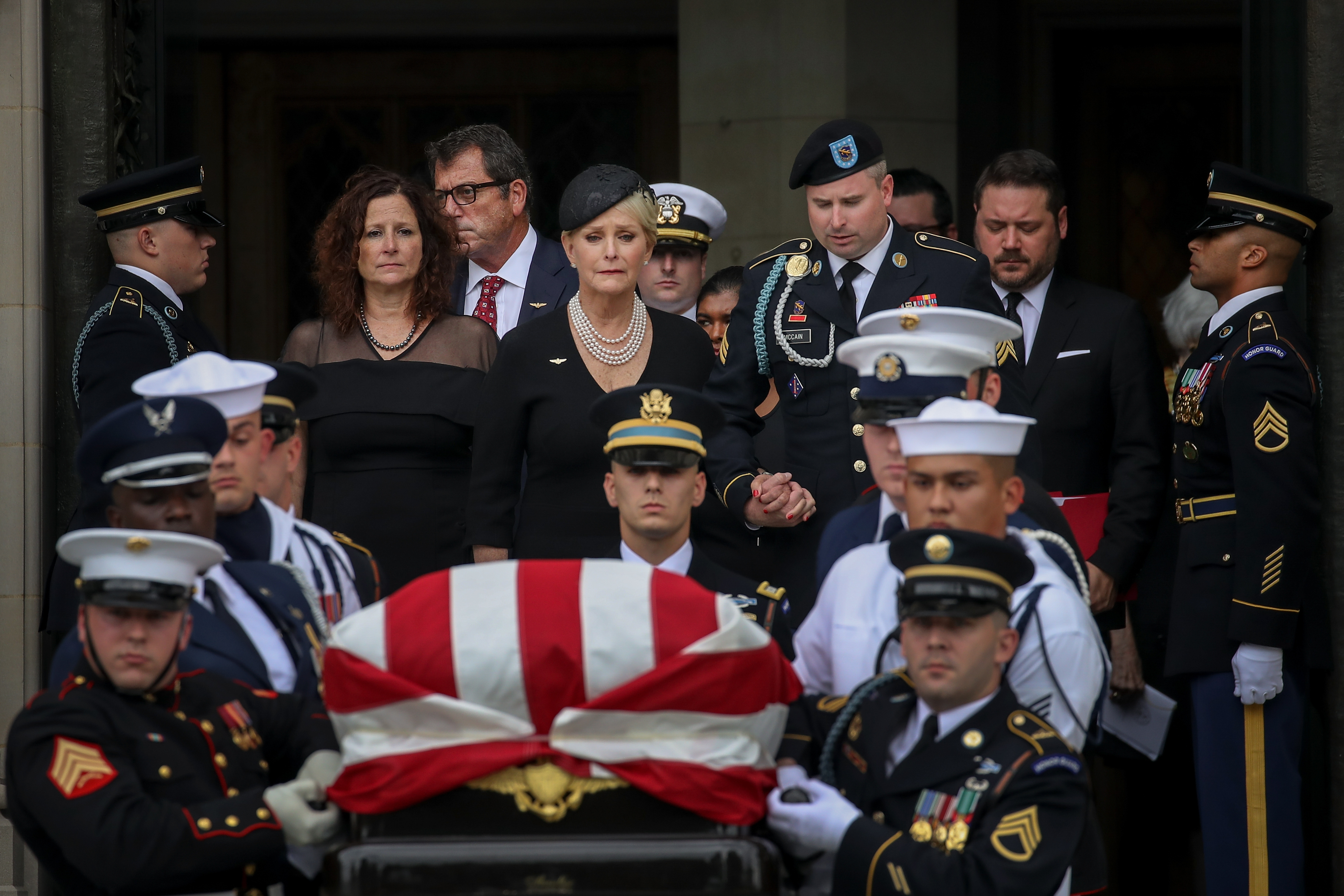 Cindy McCain followed the casket. Former presidents Barack Obama and George W. Bush spoke.