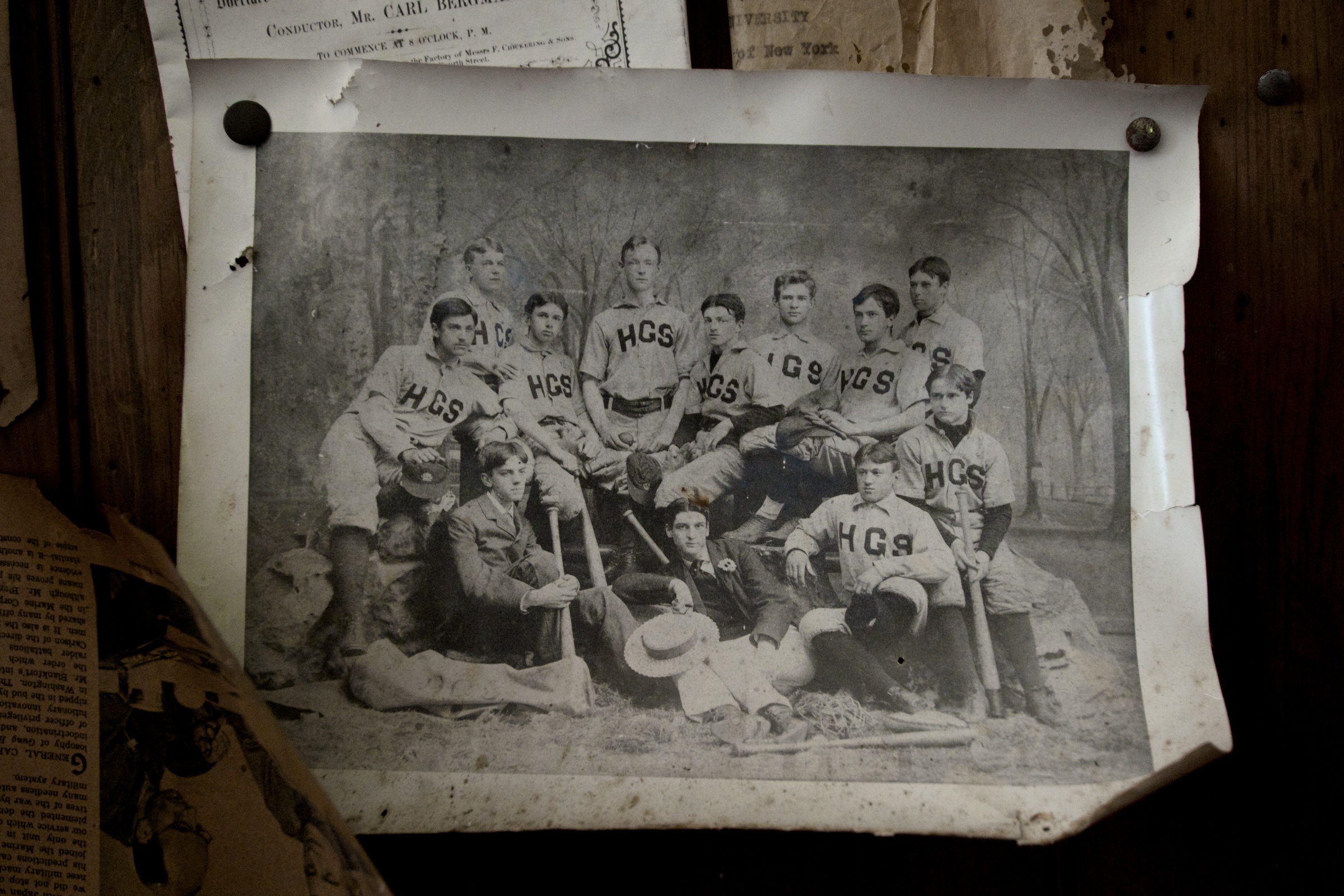 A photo of Ives (front right, with arm resting on tree stump) and his baseball teammates, circa 1890.