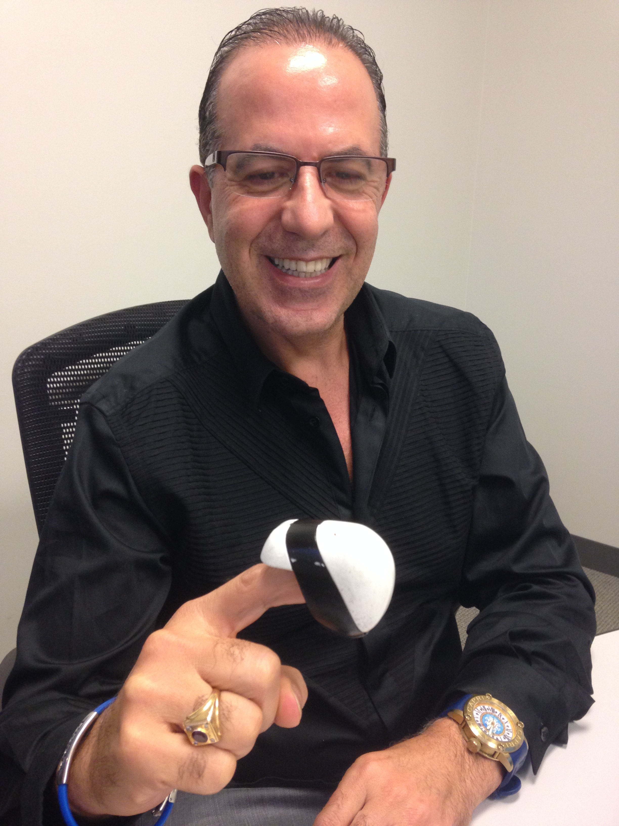 Tactai chief executive Steven Domenikos tried a prototype of the company’s touch-simulating device.