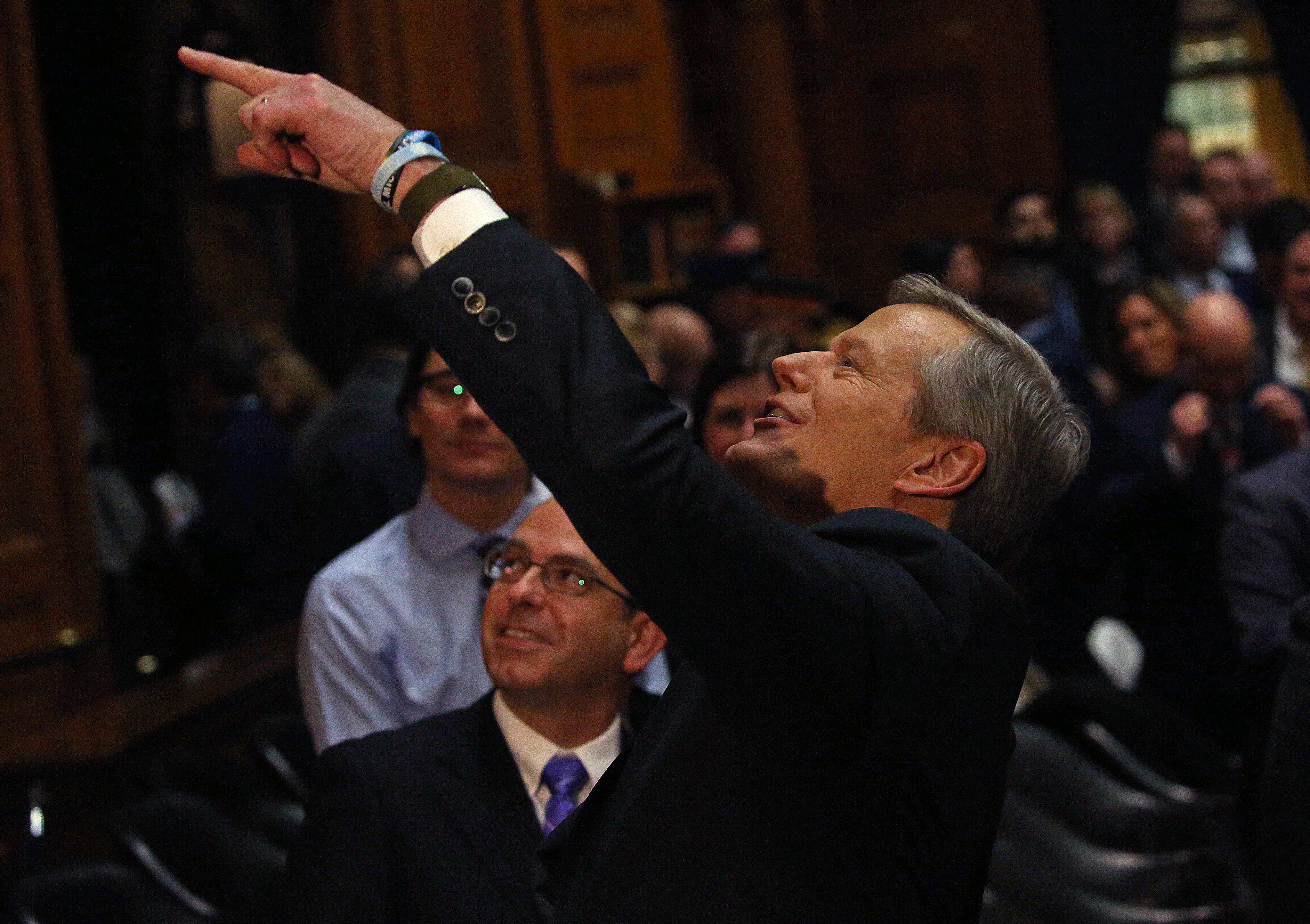Governor Charlie Baker gestured to the balcony spectators following his State of the Commonwealth address.