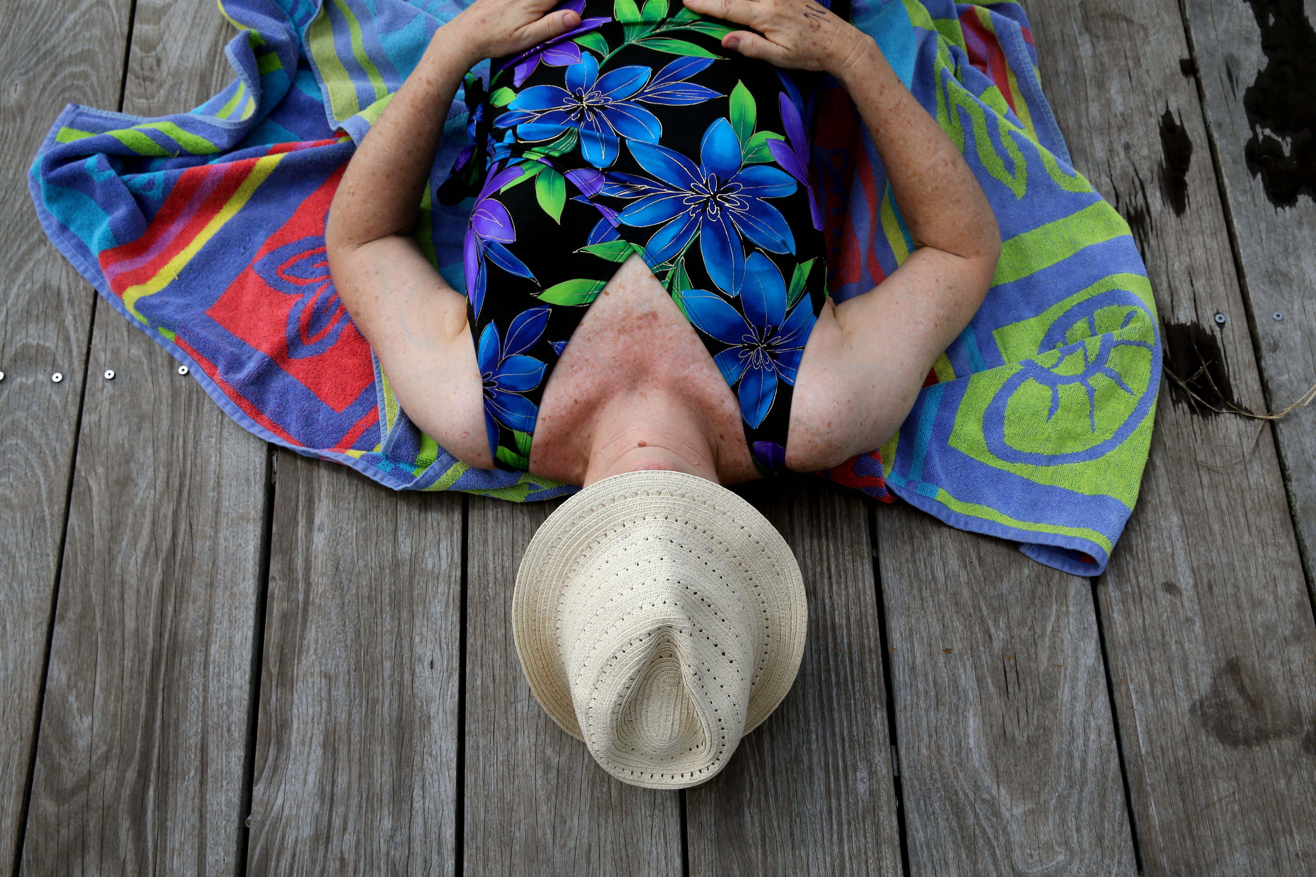 Karen Edlund relaxed on the dock before taking a dip in the Charles on Tuesday.