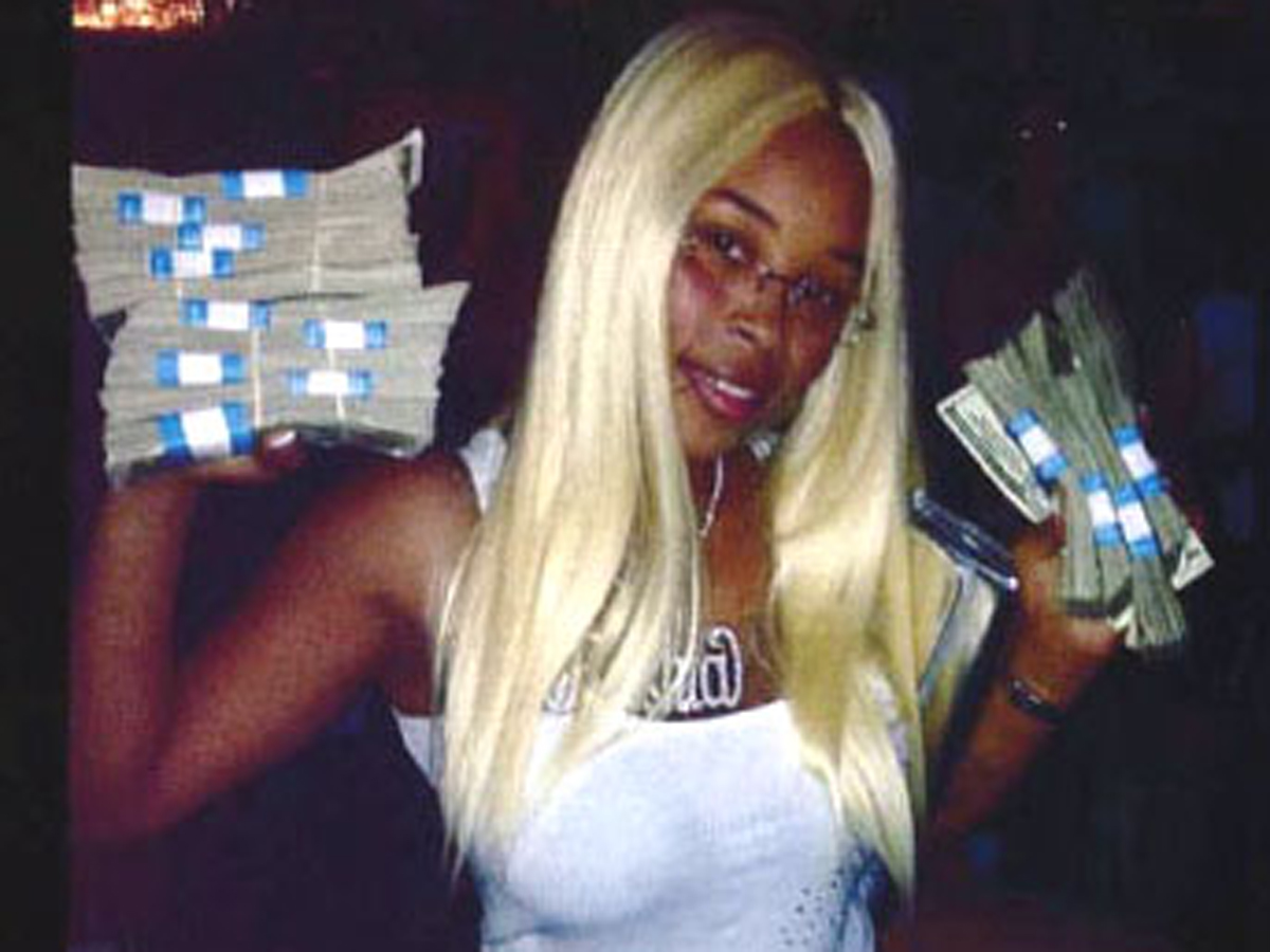 Rashia Wilson posted on her Facebook page that she was “the queen of IRS tax fraud.” This photo of her holding stacks of cash was used as evidence in a case in which she pleaded guilty to theft charges.