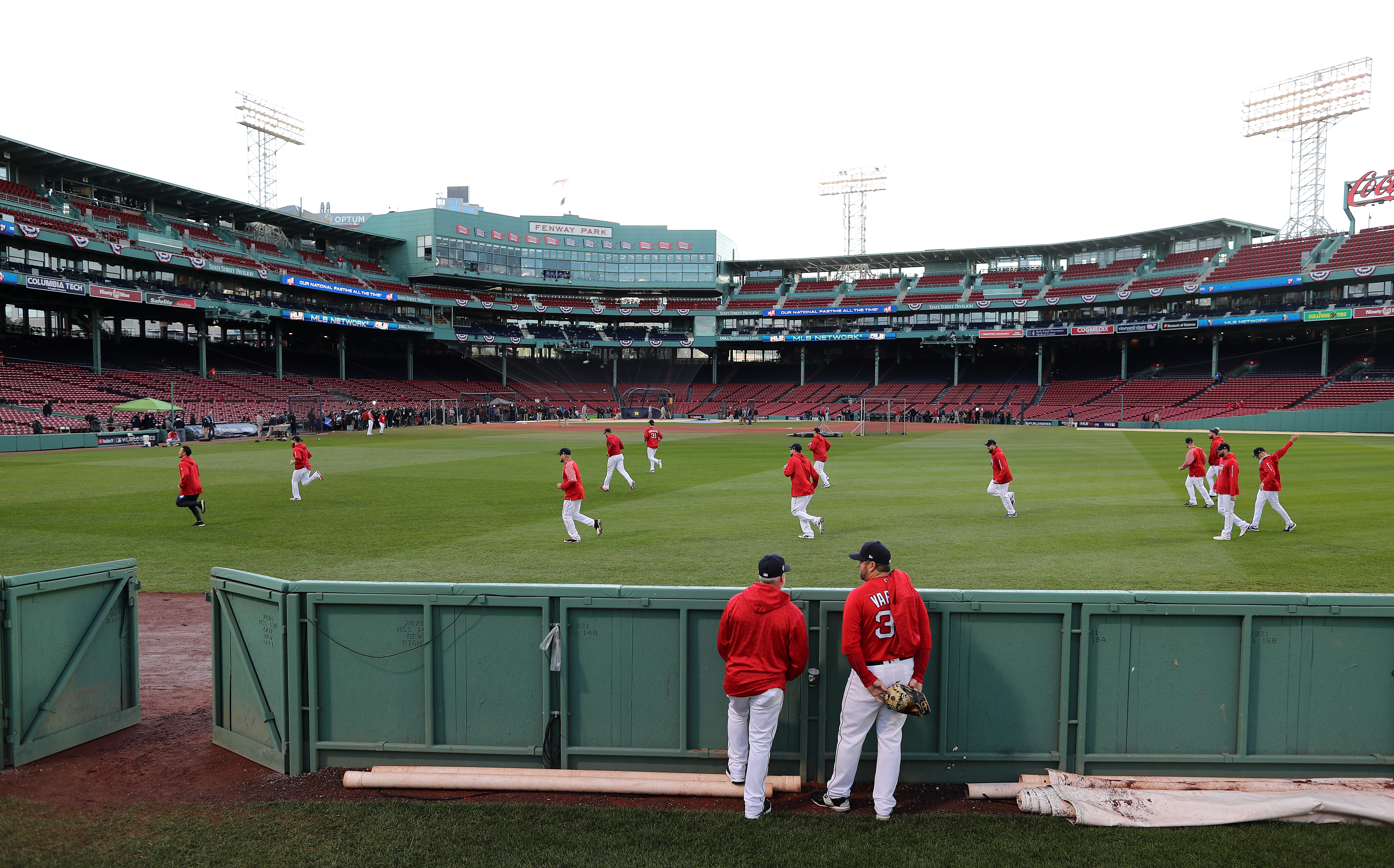 Red Sox players warm up before the game.