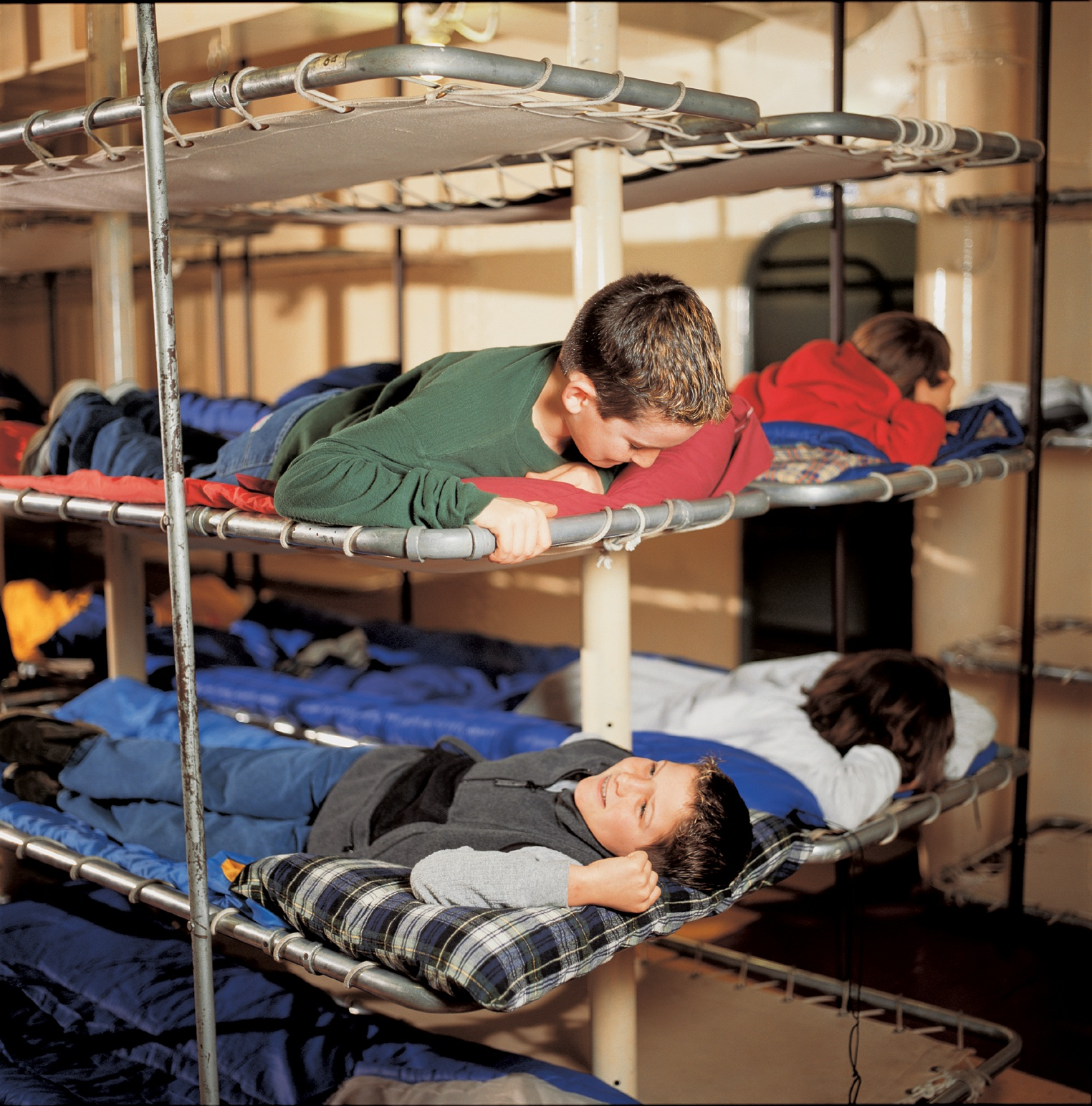 Kids sleep in bunks at Battleship Cove