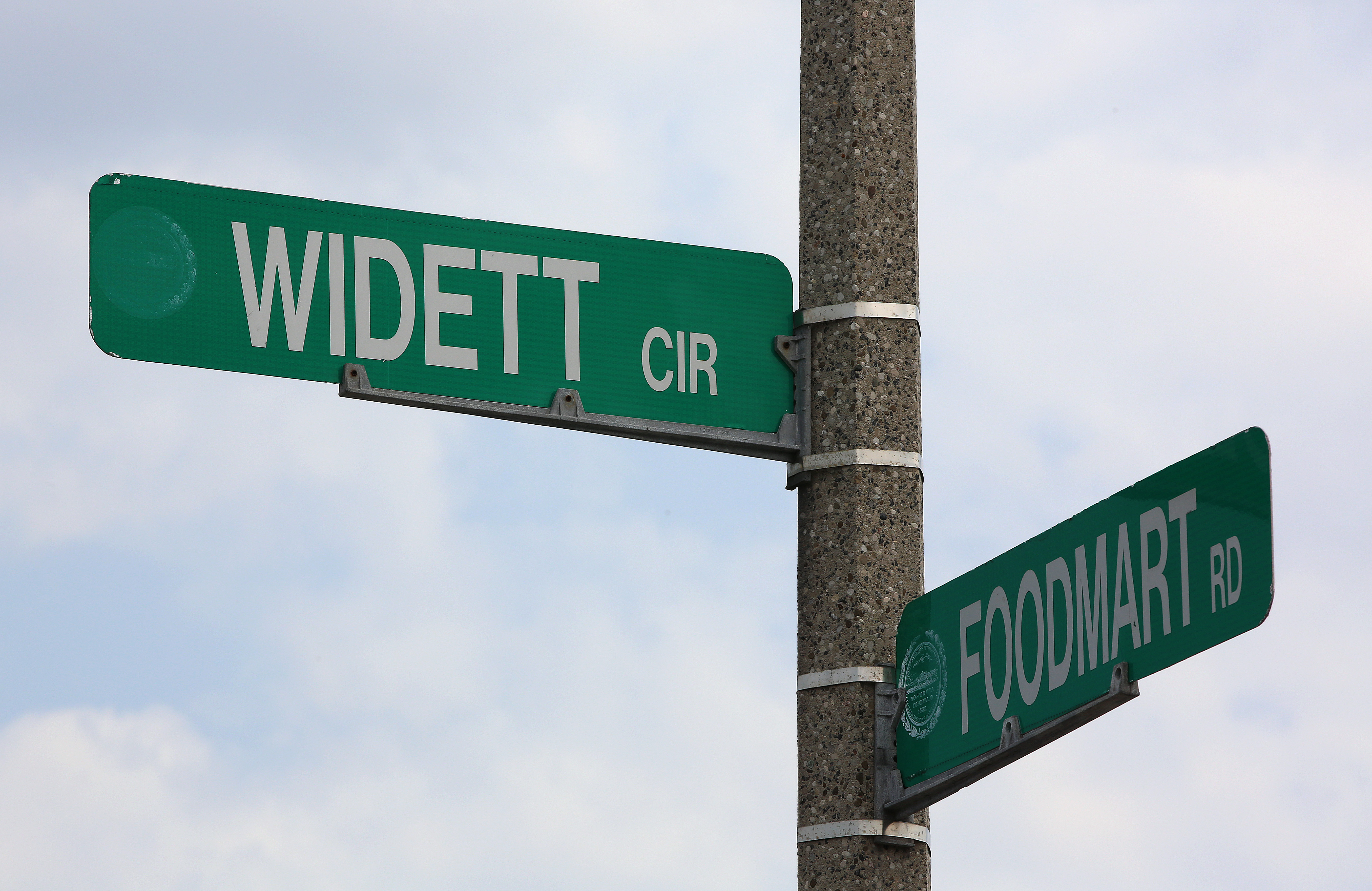 Signs at the intersection of Widett Circle and Foodmart Road.