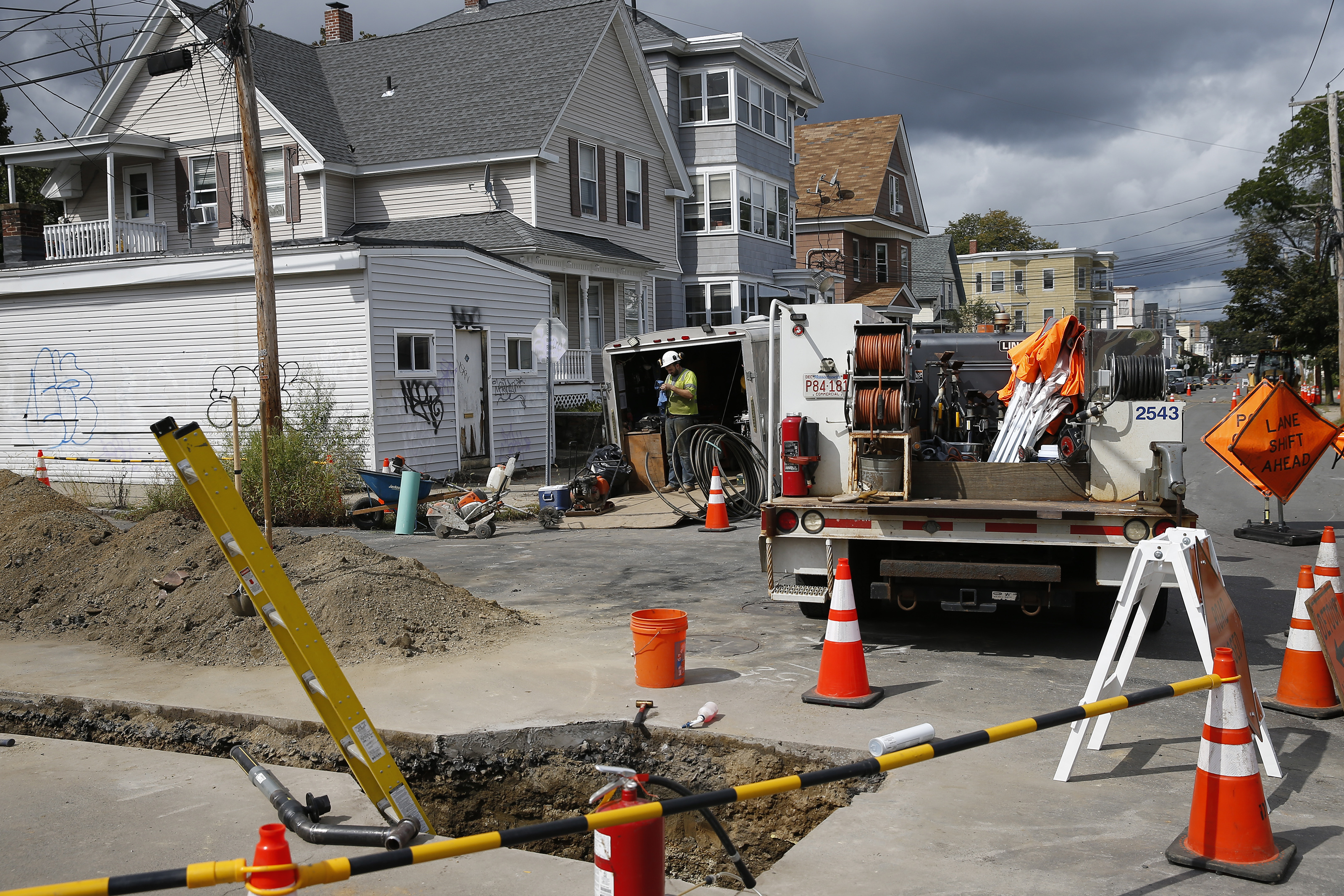 A gas worker took a break on Brookfield Street in South Lawrence.