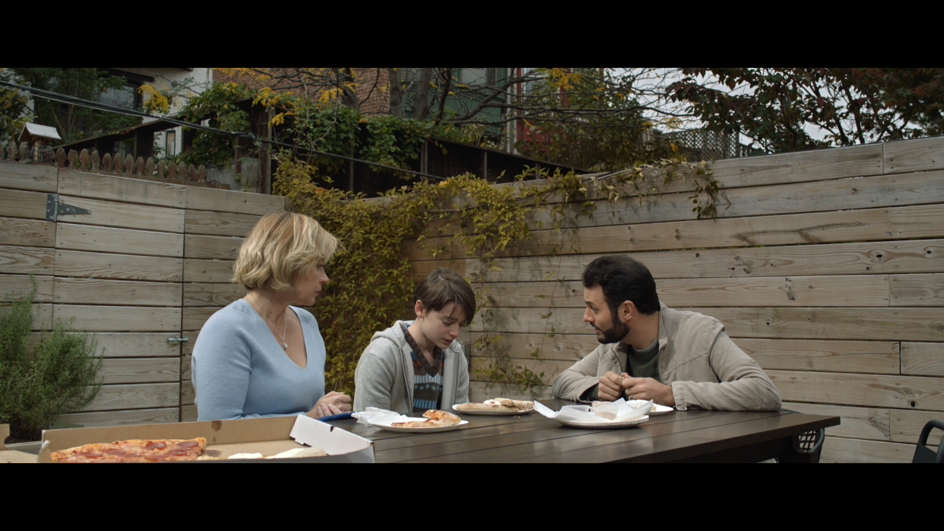 From left: Dagmara Dominczyk, Noah Schnapp, and Arian Moayed in "Abe."