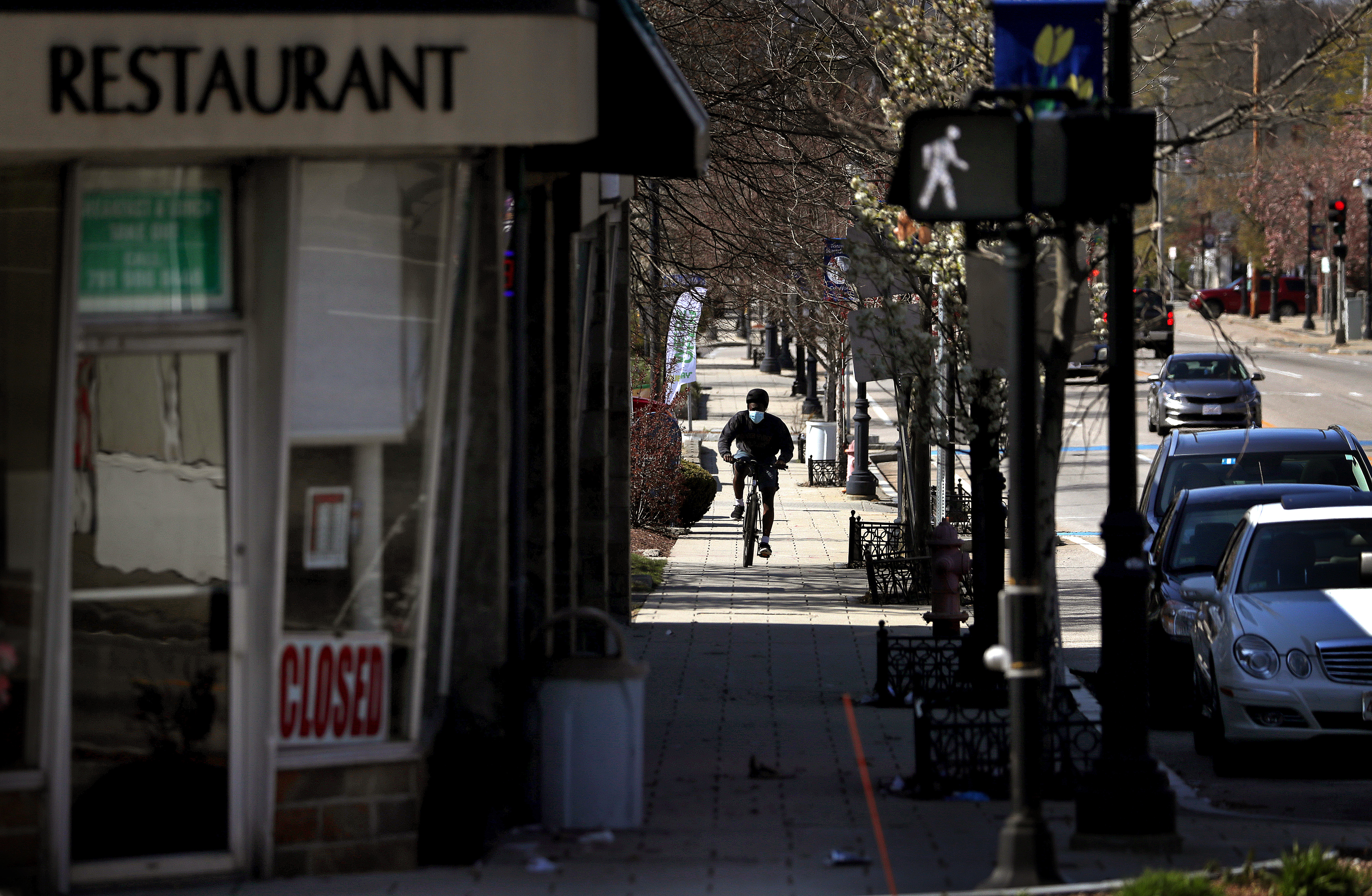A cyclist wears a mask in Randolph.