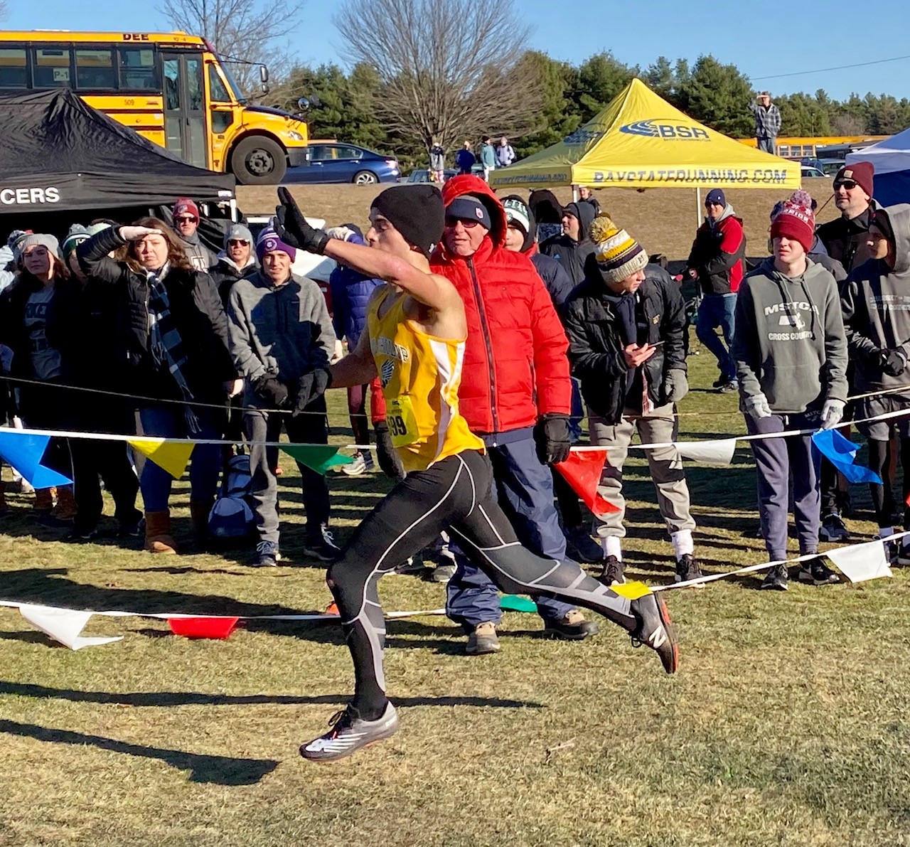 King Philip senior Mike Griffin raised his hand in victory as he crossed the finish line in the Division 1 race Saturday in Gardner.