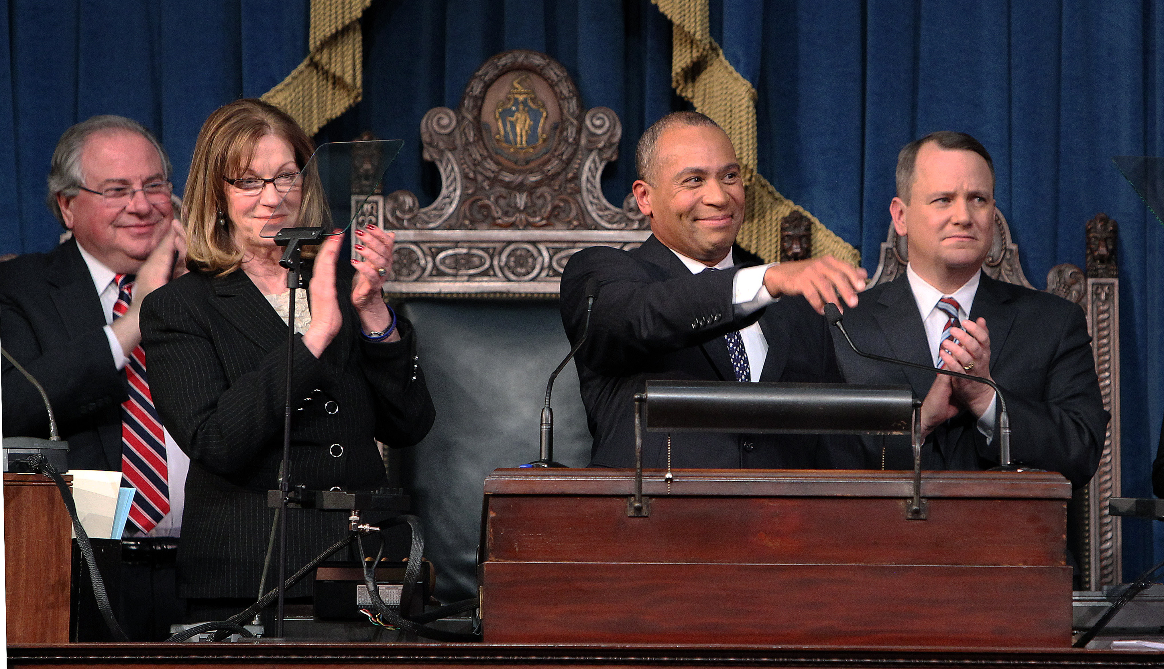 After Governor Deval Patrick gave his annual State of the Commonwealth address, House Speaker Robert A. DeLeo (left), Senate President Therese Murray, and Lieutenant Governor Timothy P. Murray rose to applaud.