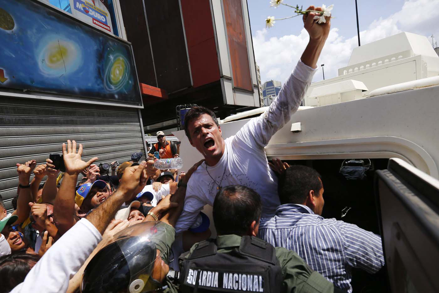 Venezuelan opposition leader Leopoldo Lopez surrendered to security forces on Feb. 18 after charges were lodged against him following a protest rally.
