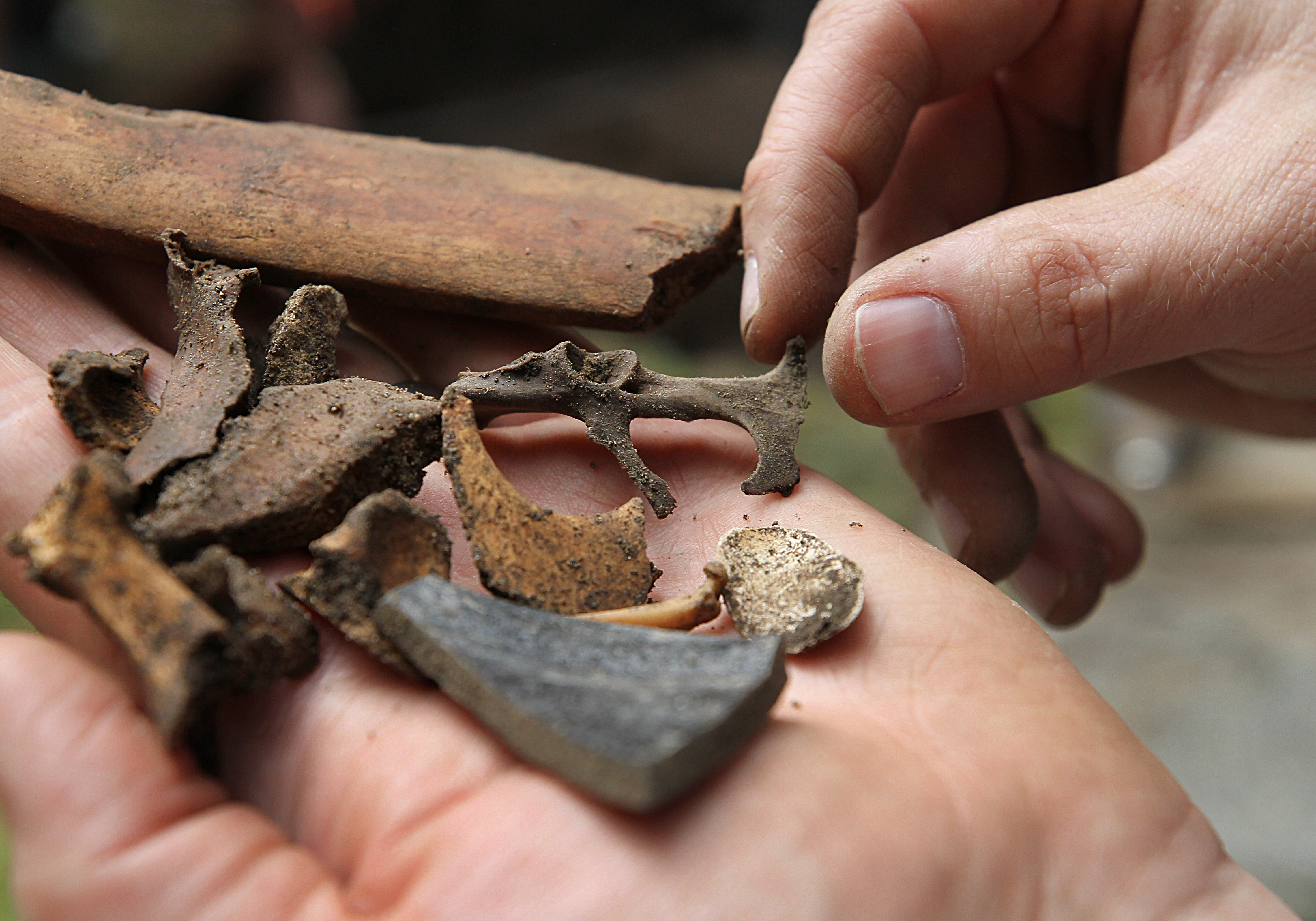 Boston archeologist Joe Bagley showed some of the objects found at the house so far, including ceramic and bones.