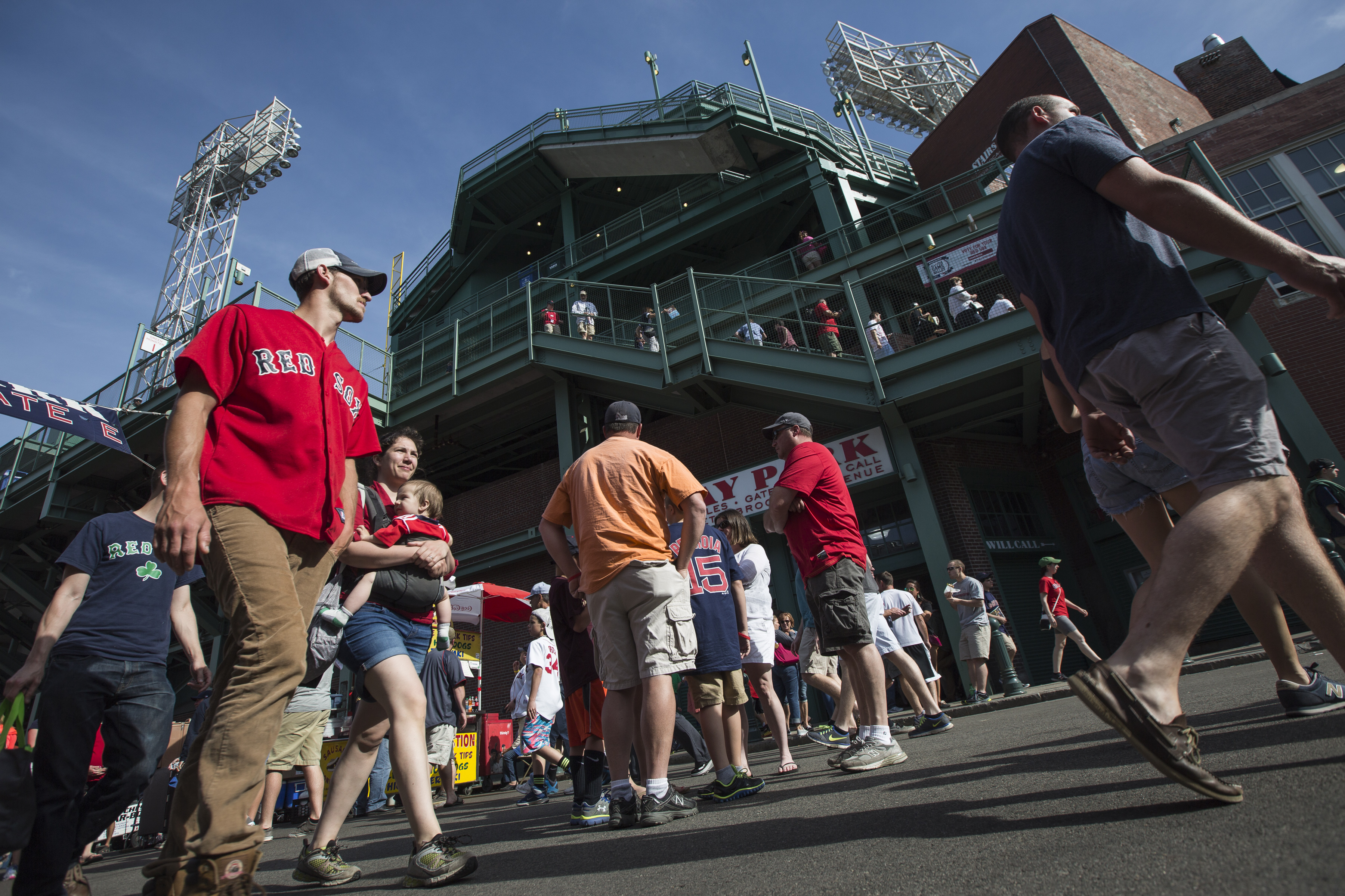 Fans head to Fenway to cheer the team at their own risk, signs and tickets say.