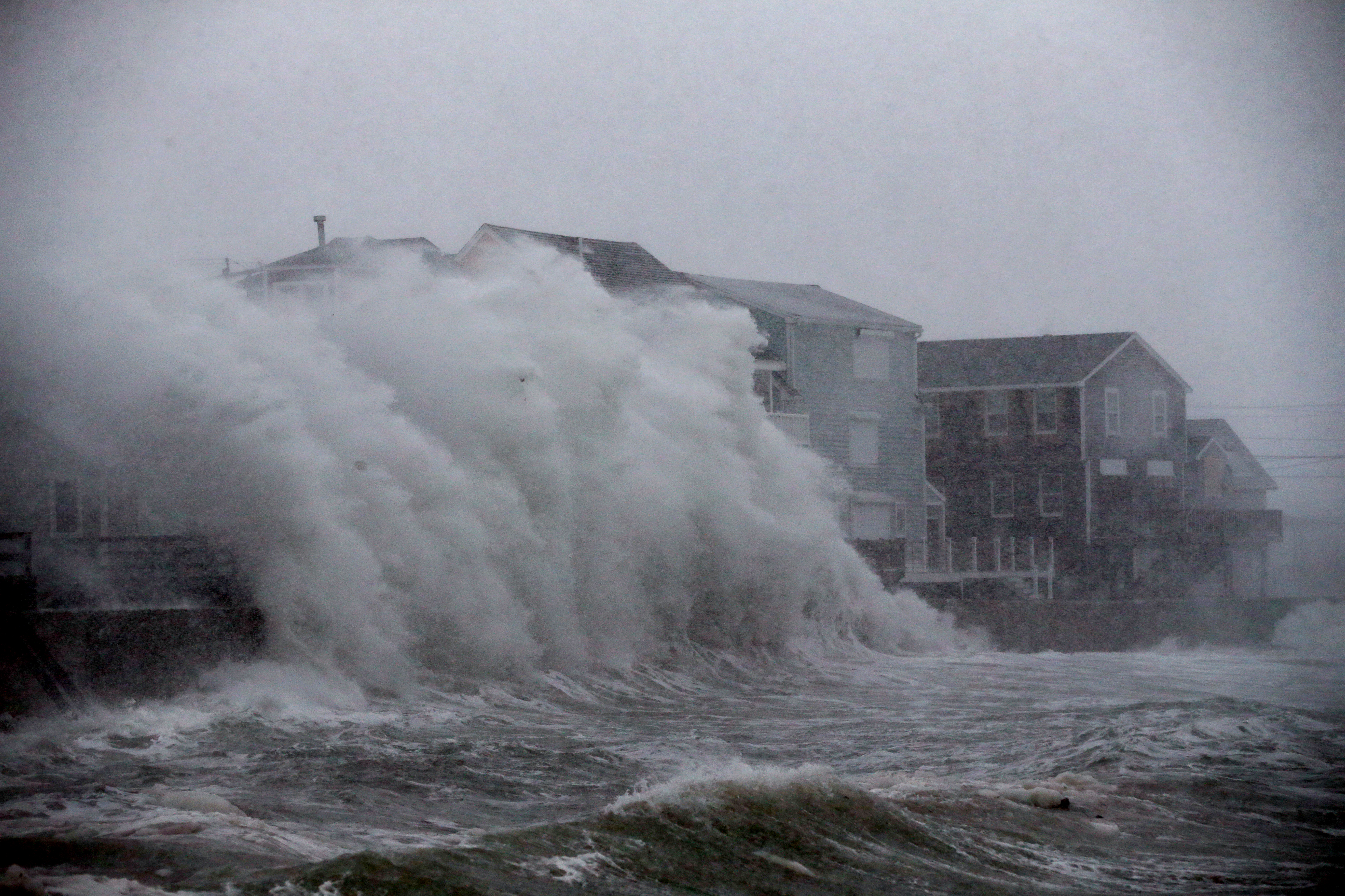 Waves crashed against homes on Turner Road during blizzard conditions in Scituate.