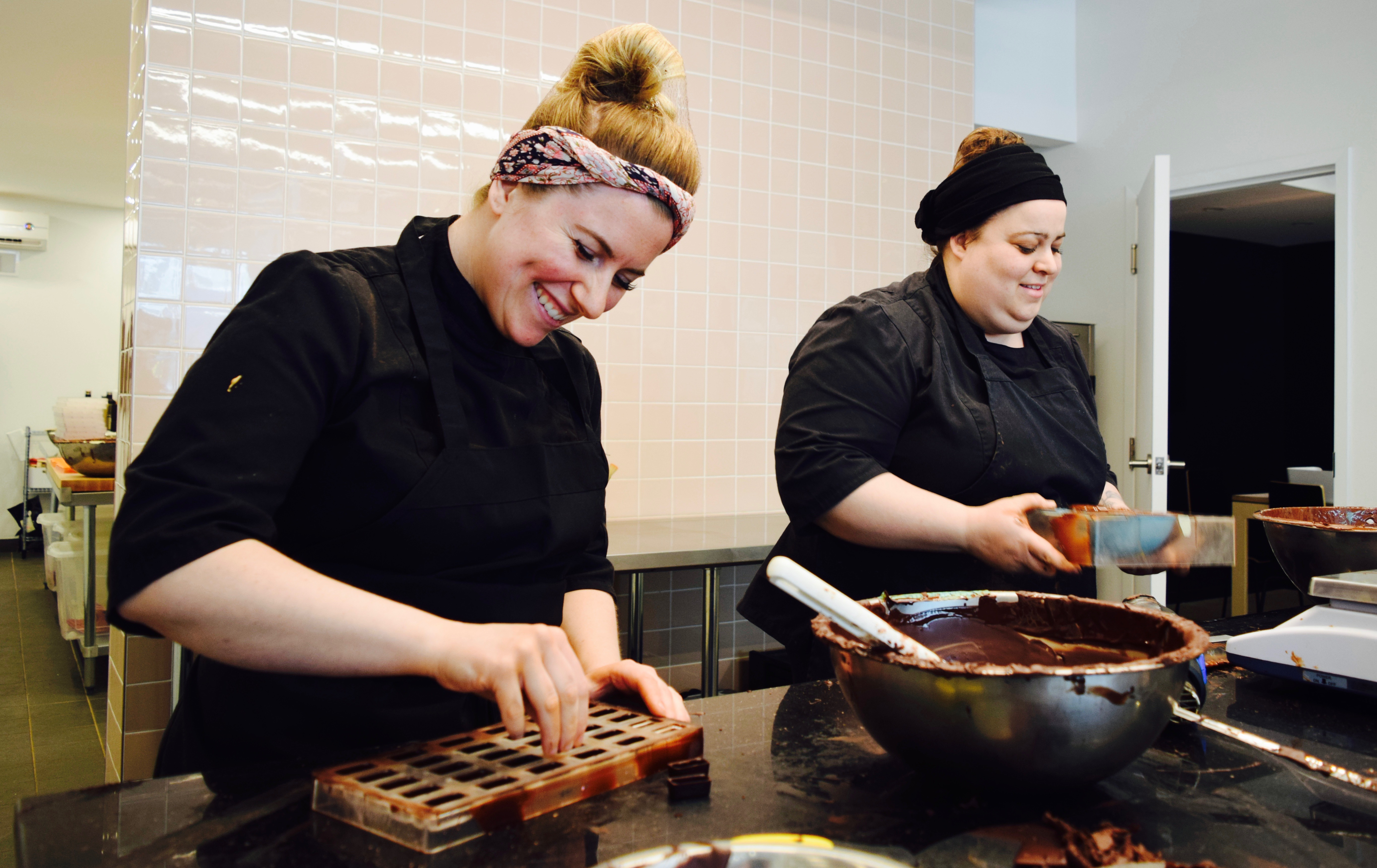 Stéphanie Bélanger (right), chocolate chef at État de Choc, gets help in the kitchen of the shop from Eve Burelle.