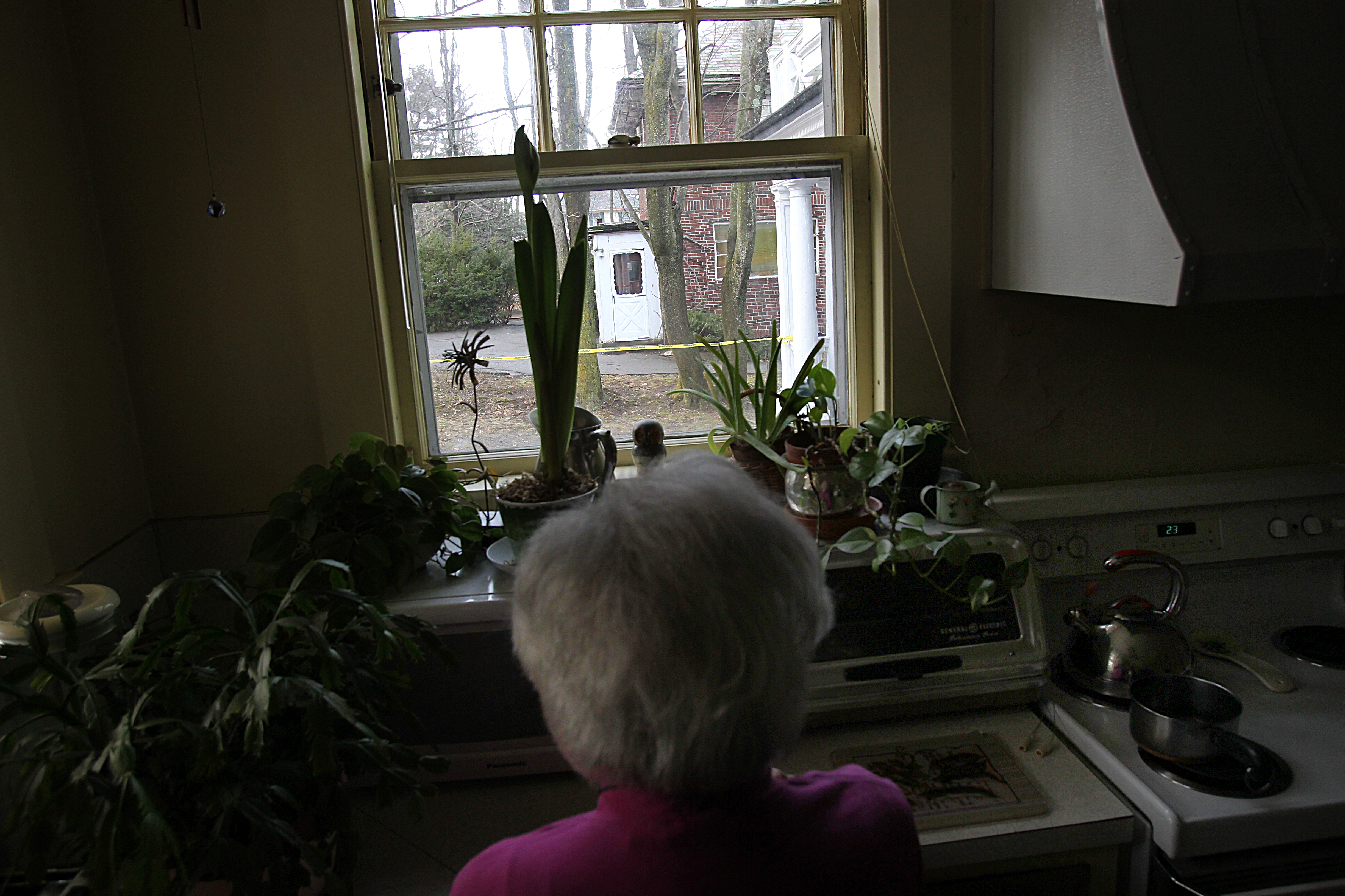 Harriet Allen lives next door to the home where the two elderly sisters lived. This is the kitchen window where she could see them, now and then.