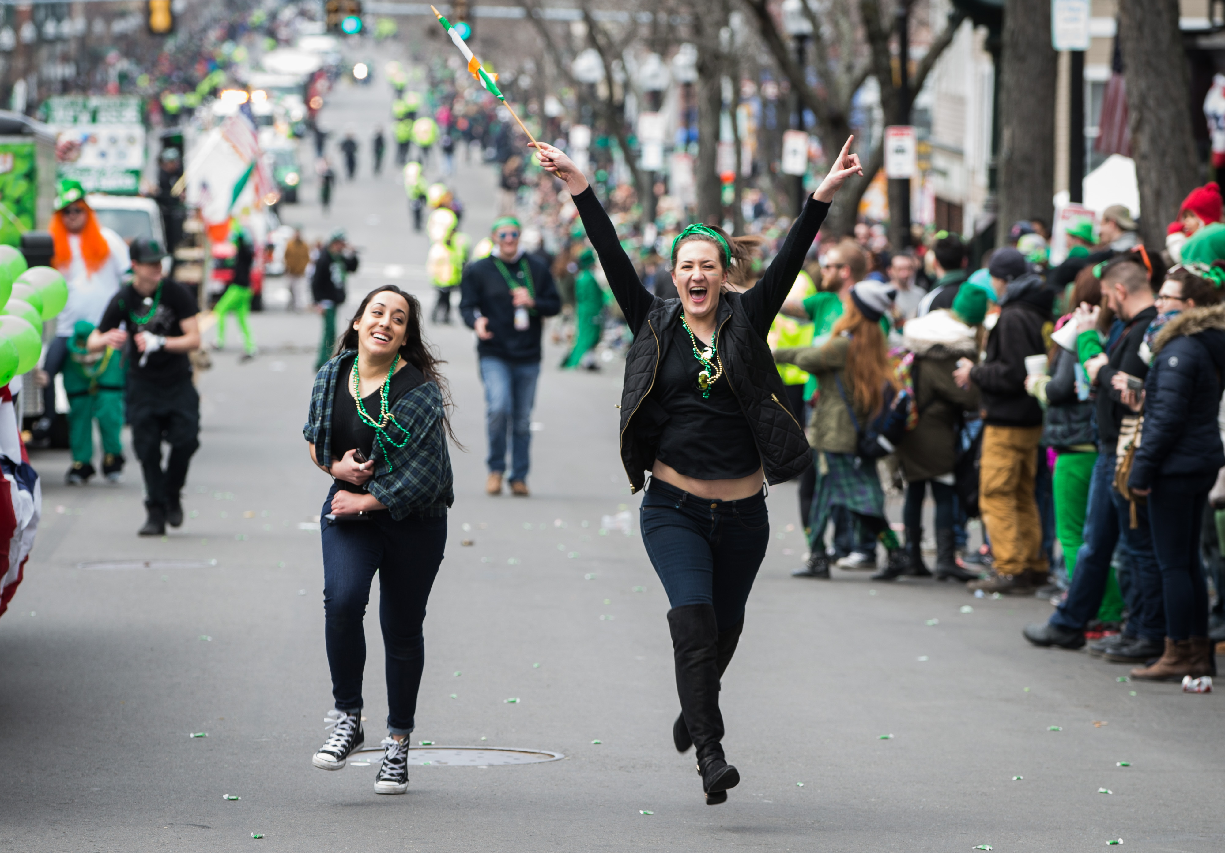 Spectators ran along Broadway, part of the restored parade route, on Sunday in South Boston.