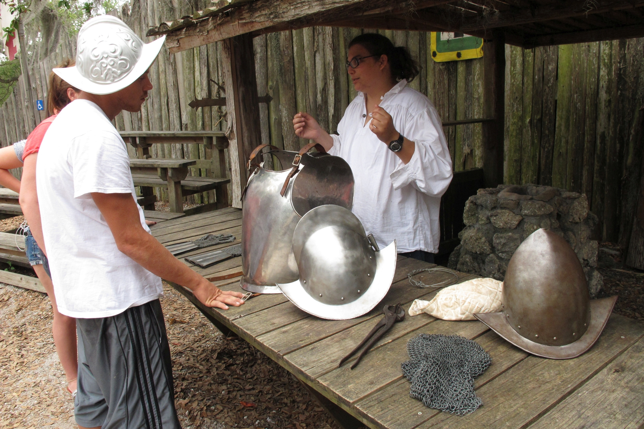An interpreter at the De Soto National Memorial shows visitors replicas of 16th-century Spanish armor.