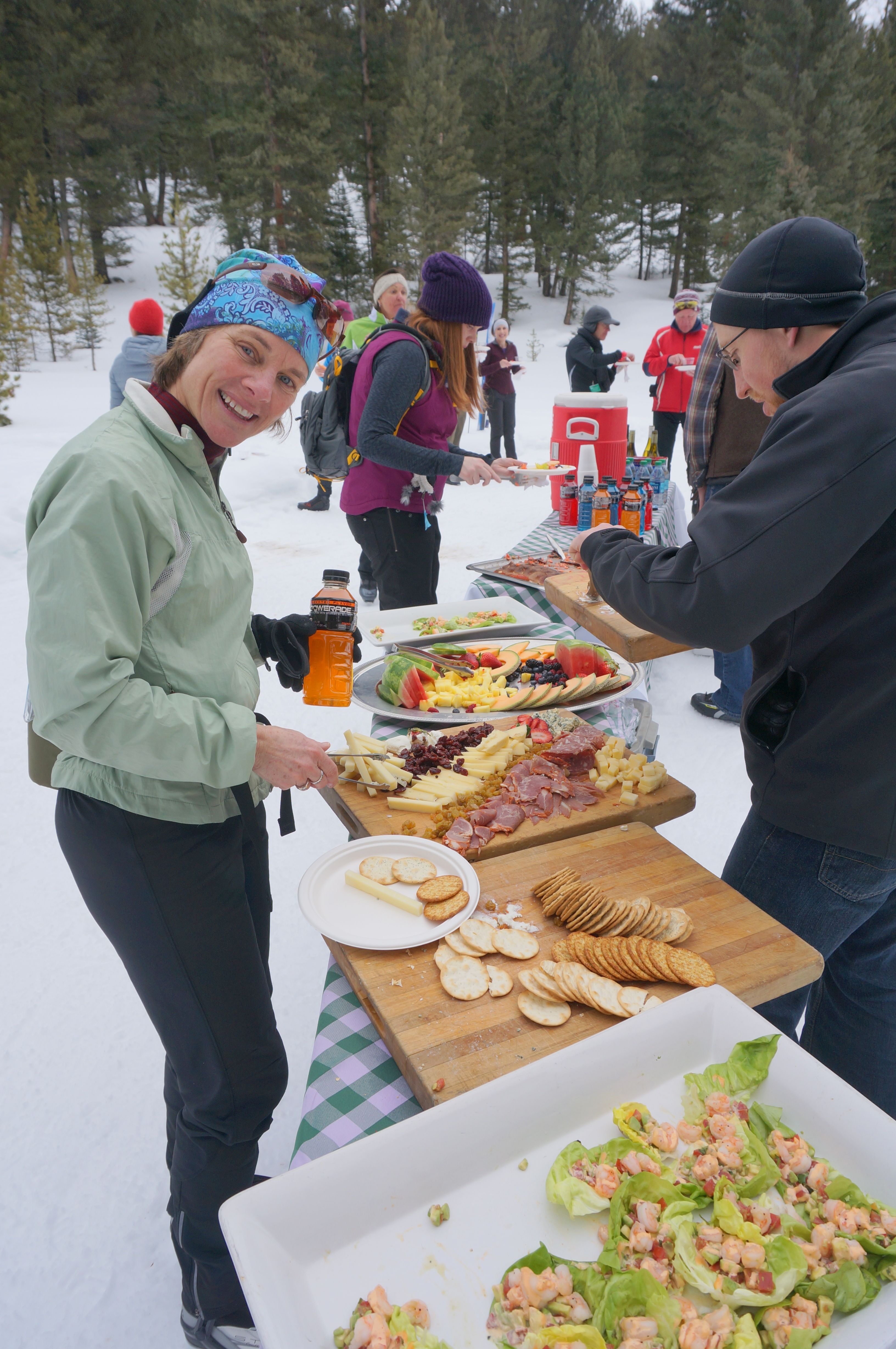 Stopping for a bite at one of the food and drink stations at Lone Mountain Ranch’s “Glide and Gorge.”