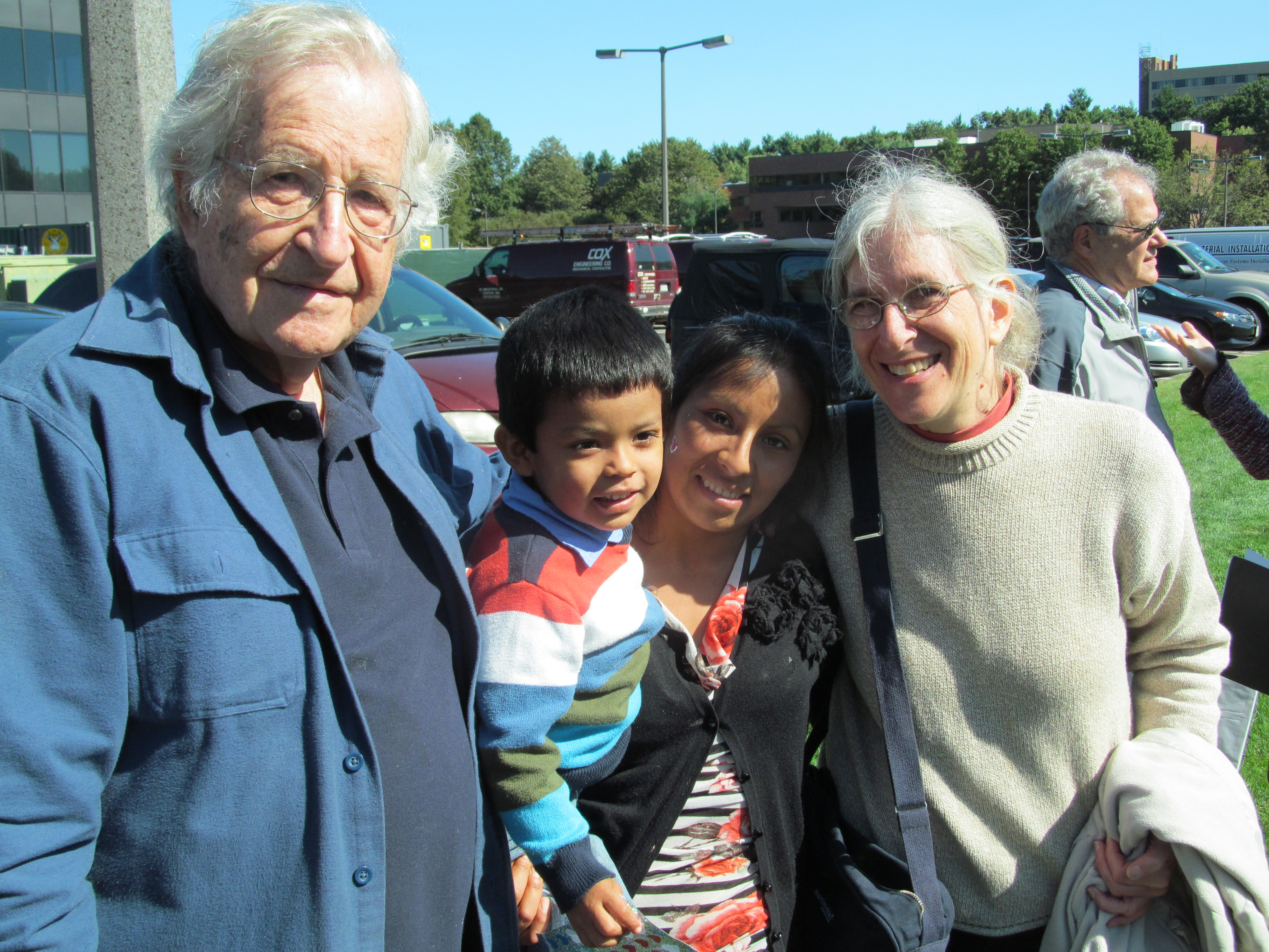 Noam Chomsky (left) and Aviva Chomsky (right) with Mariola Perez and her son Ernesto, 3, at the Sept. 17 rally.
