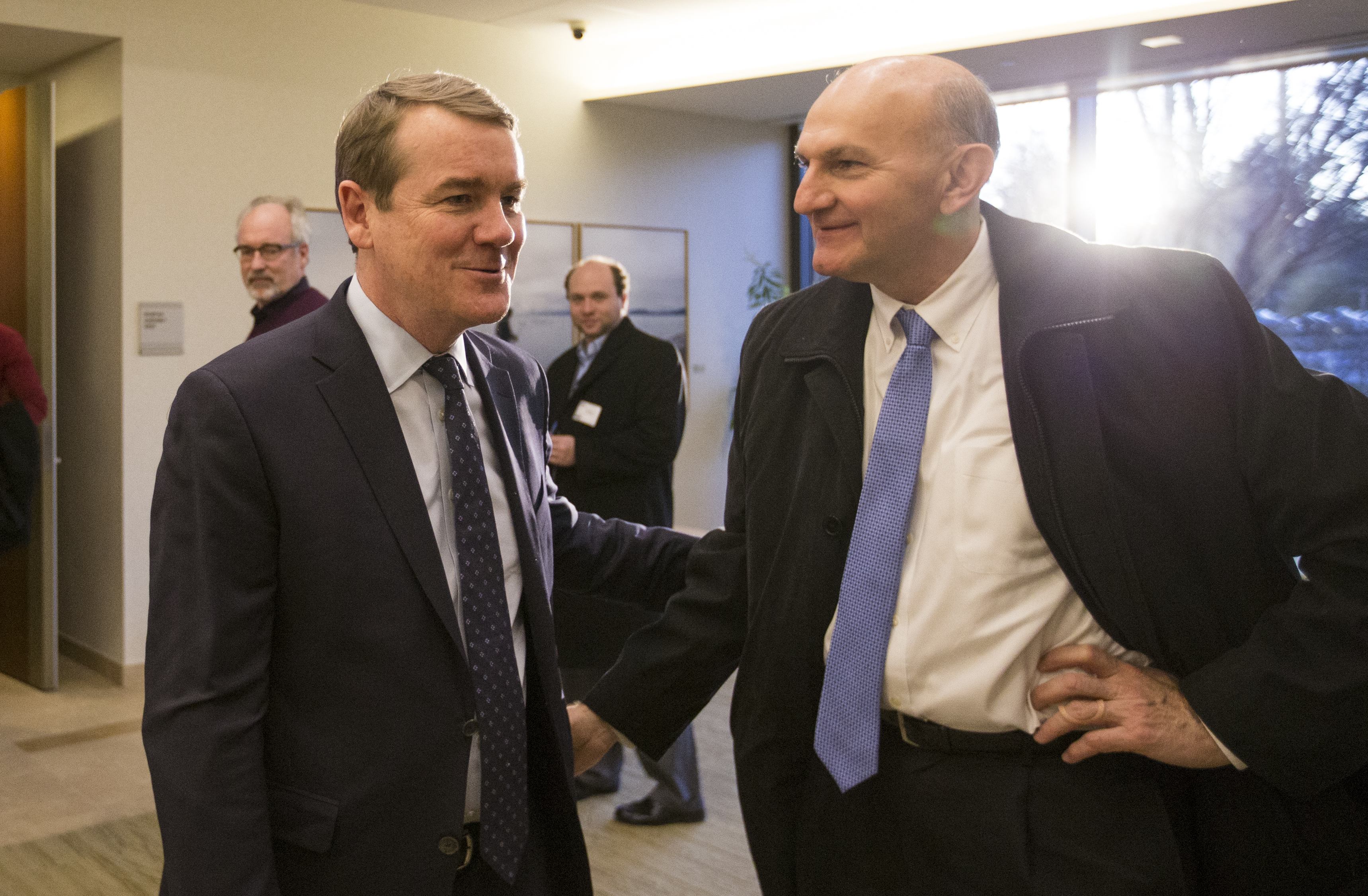 Senator Michael Bennet of Colorado (left) after one of his 50 pledged town halls in the Granite State ahead of their first-in-the-nation primary next month.
