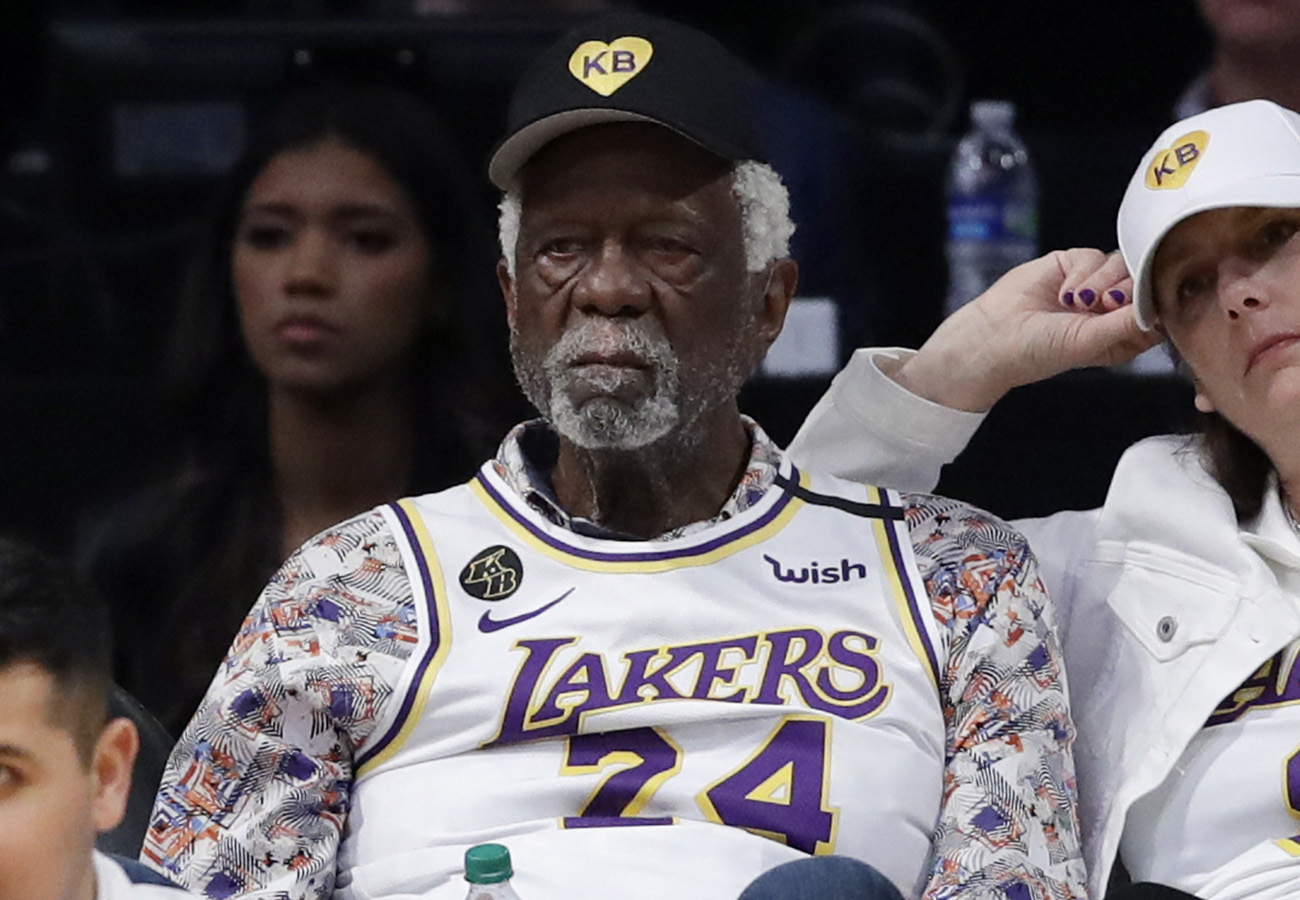 Hall of Famer Bill Russell takes in the action.