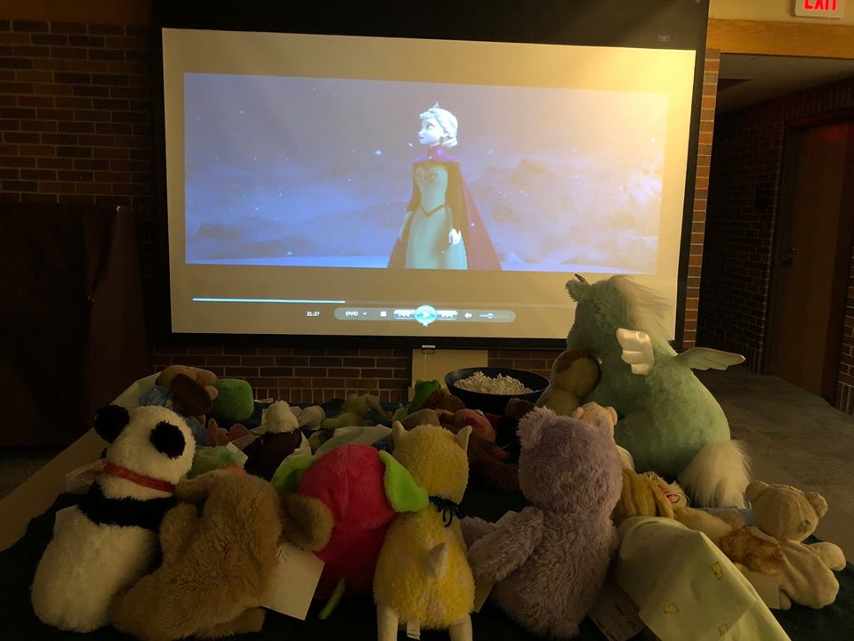 The staff then took photos of the toys causing mischief, brushing their teeth, playing at a local park, watching “Frozen,” and eating Chinese food and pizza