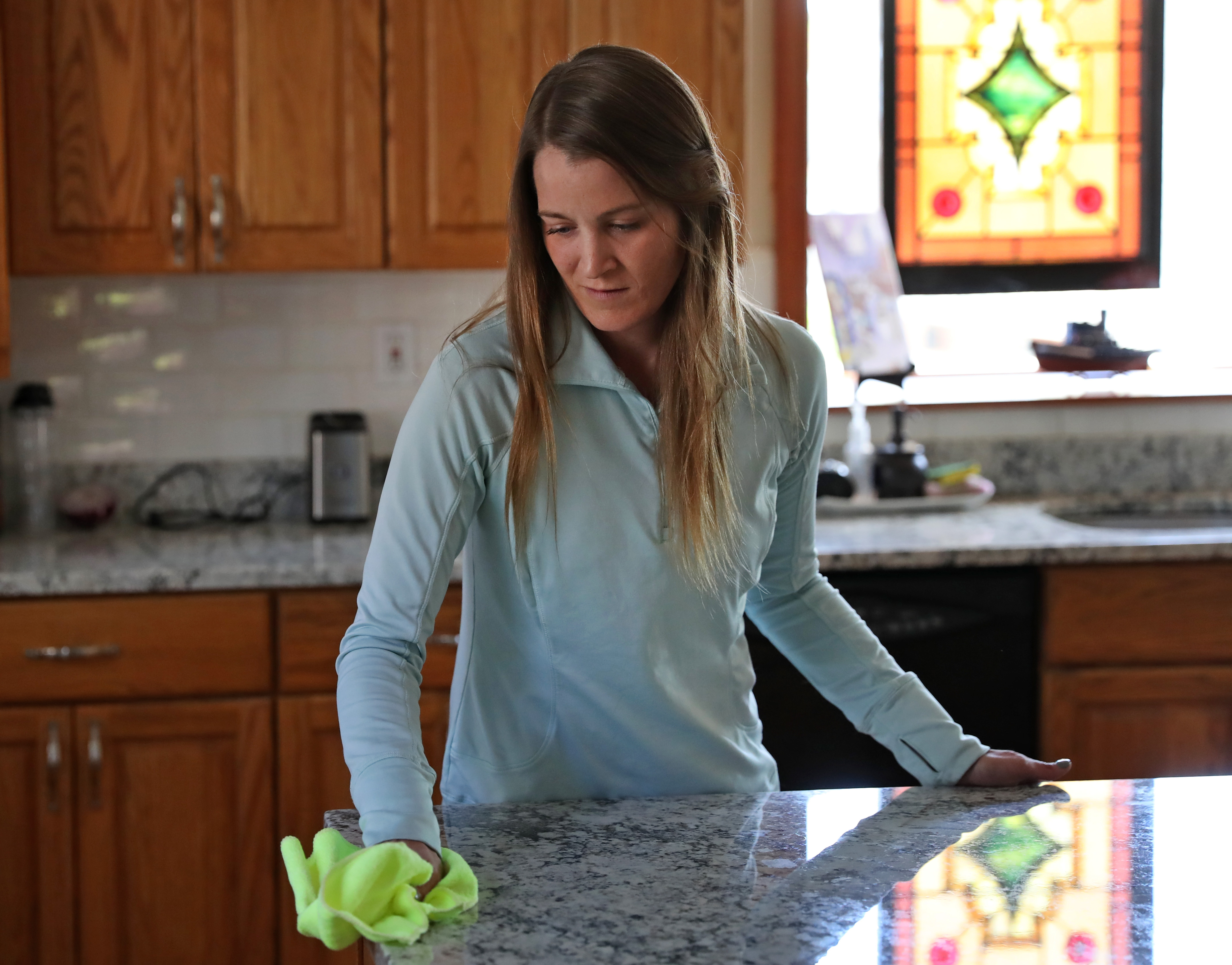 Janine Loud, one of two people recently hired for the Boston branch of Well-Paid Maids, at a home in Winthrop.