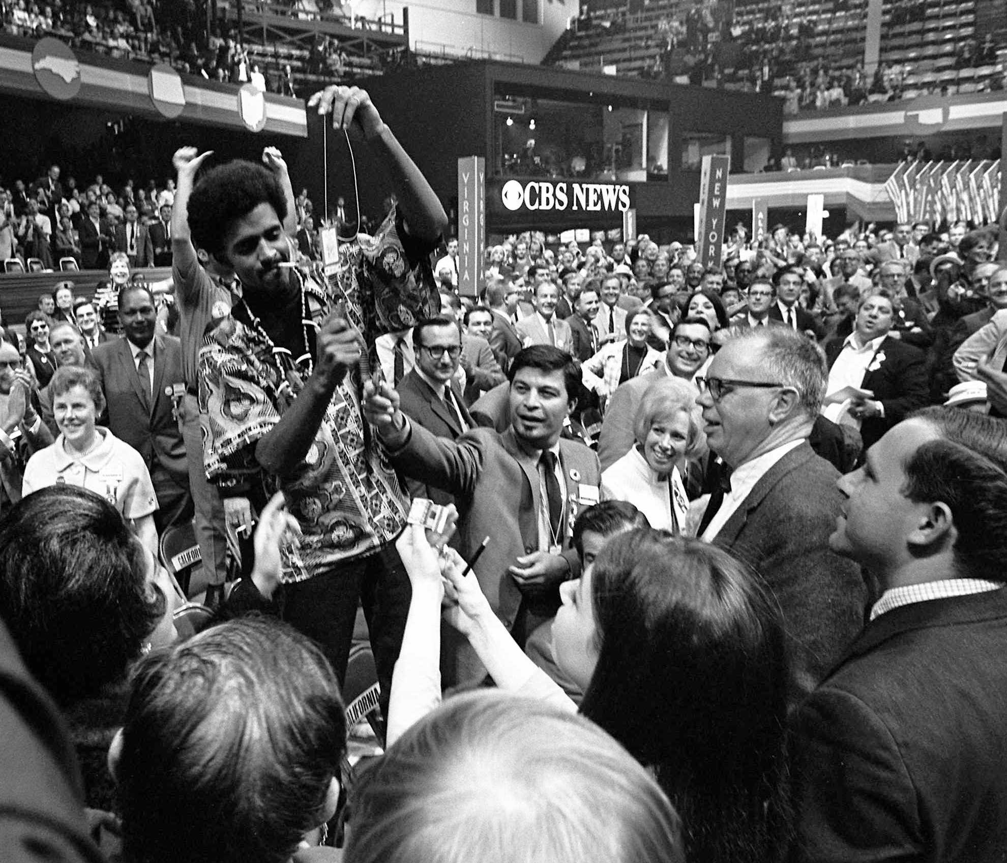 Eddie Anderson of Los Angeles tried to burn his delegate card on the floor of the Democratic National Convention.