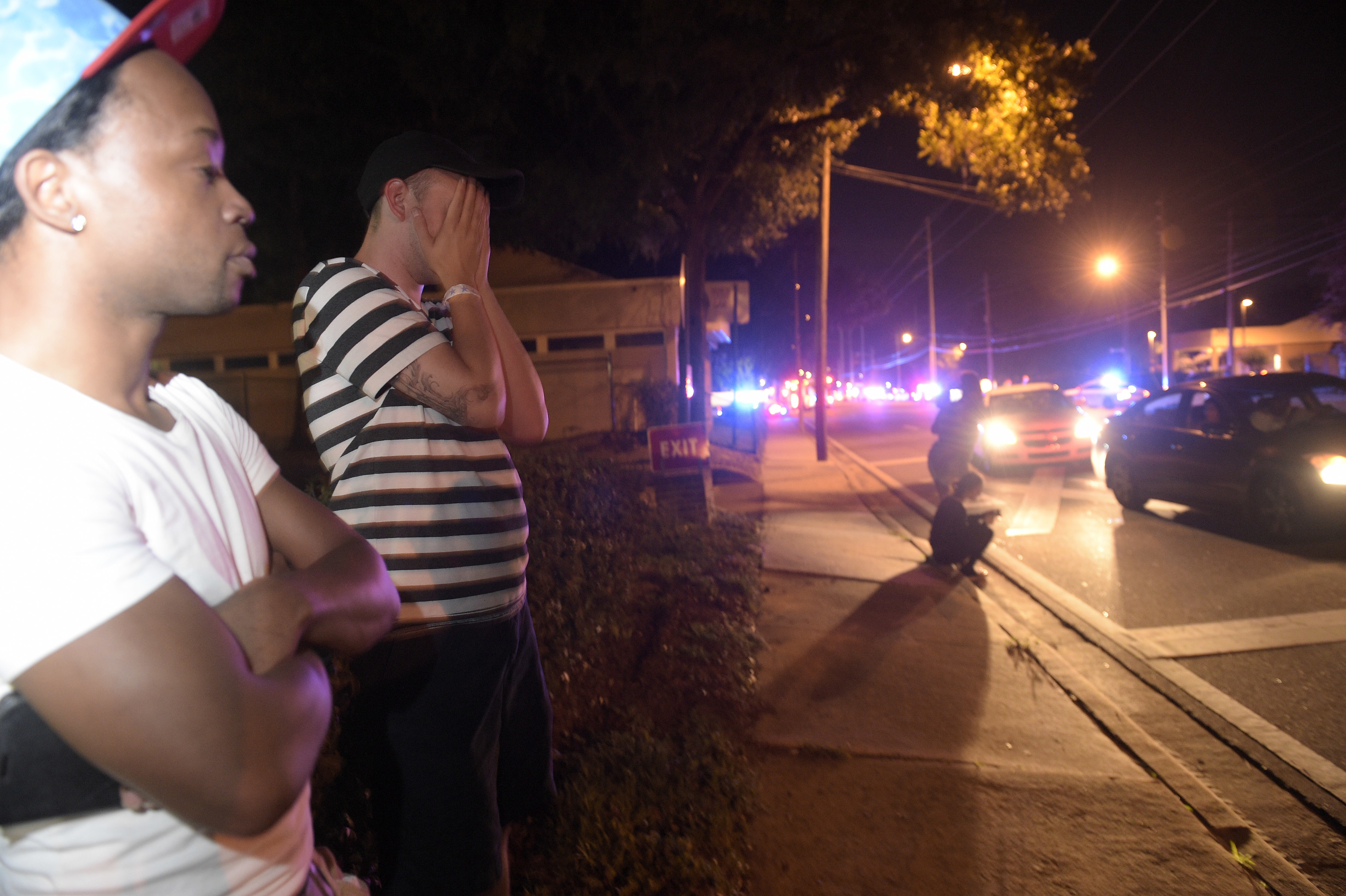 Jermaine Towns (left) and Brandon Shuford stood near the shooting scene early Sunday.