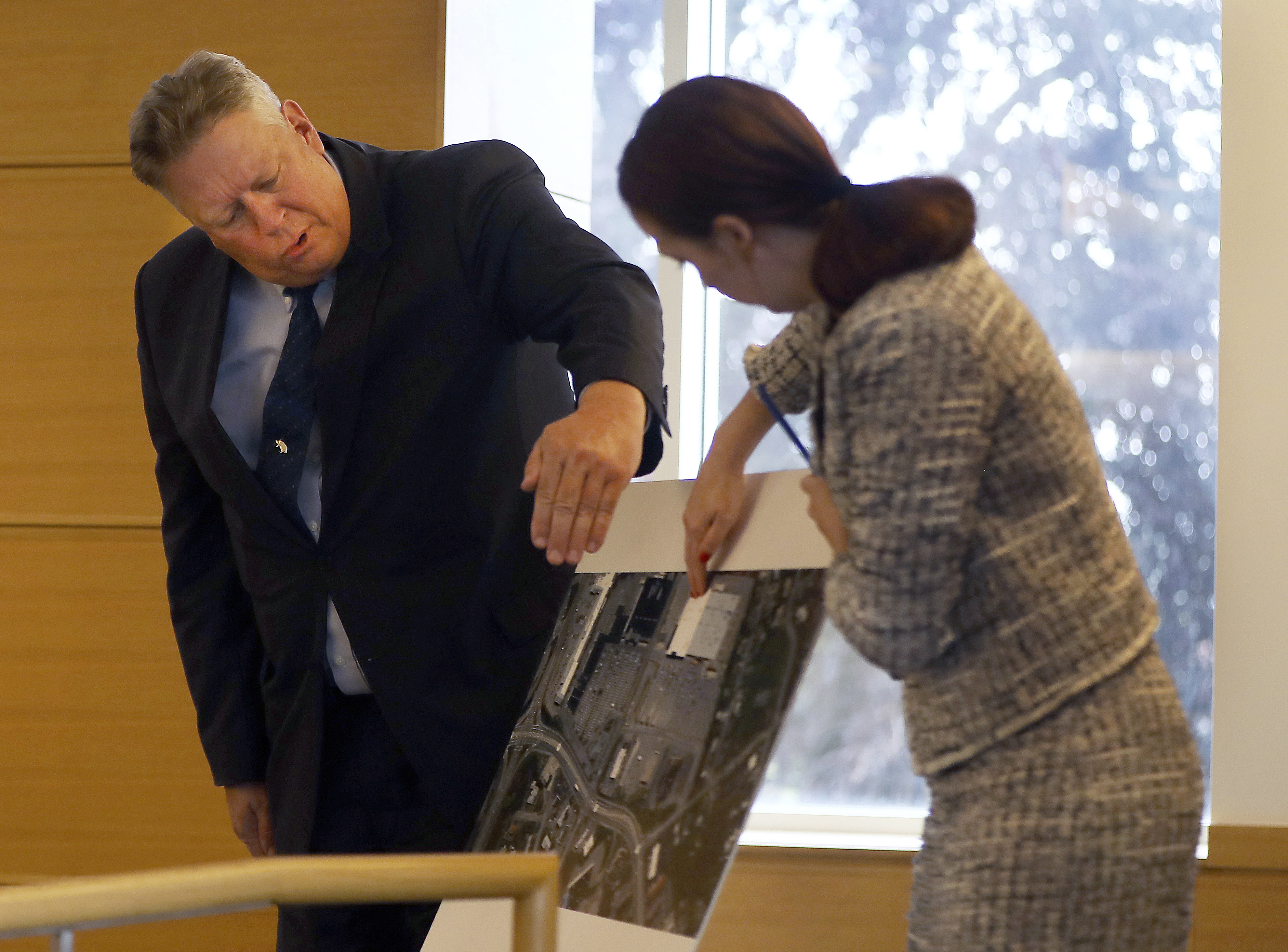Retired Fairhaven officer David Michael Correia, left, went over a map of part of his search area with prosecutor Katie Rayburn.
