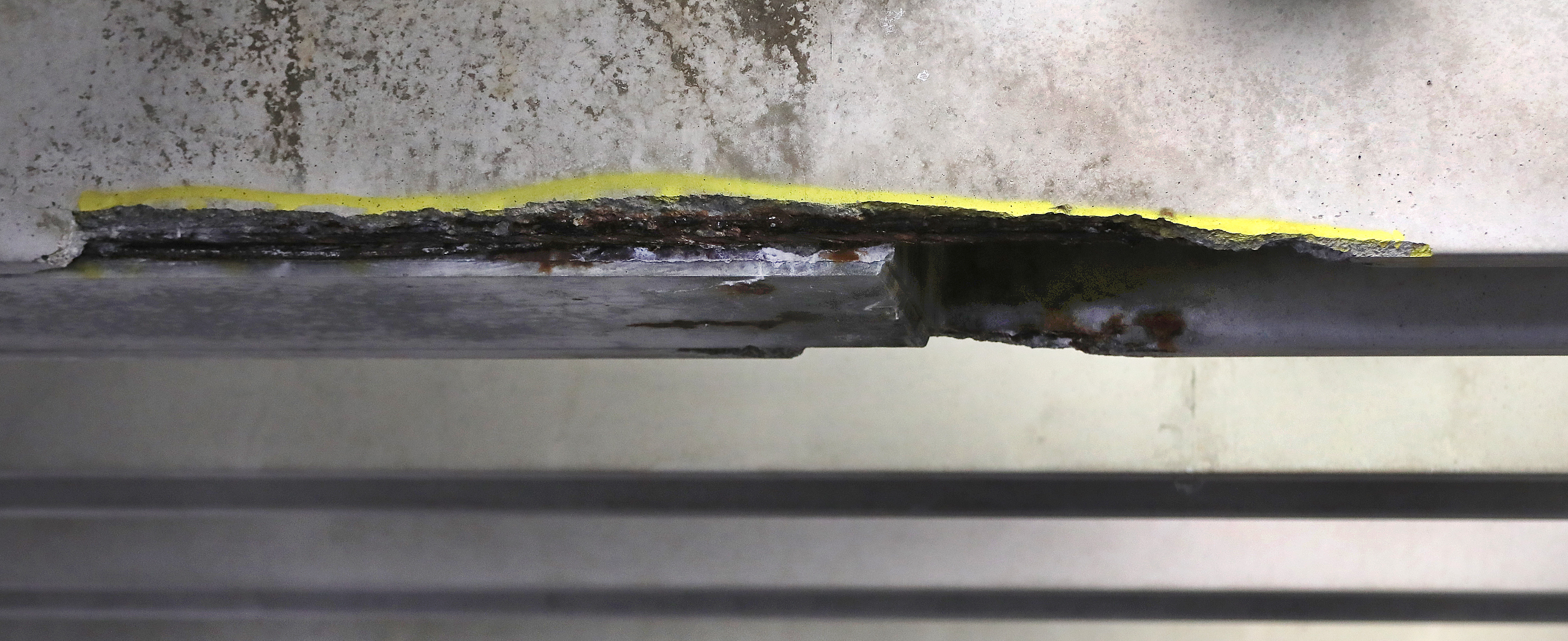 Paint marked the spot, on the second level of the Alewife T station parking garage, from where concrete fell on a vehicle.